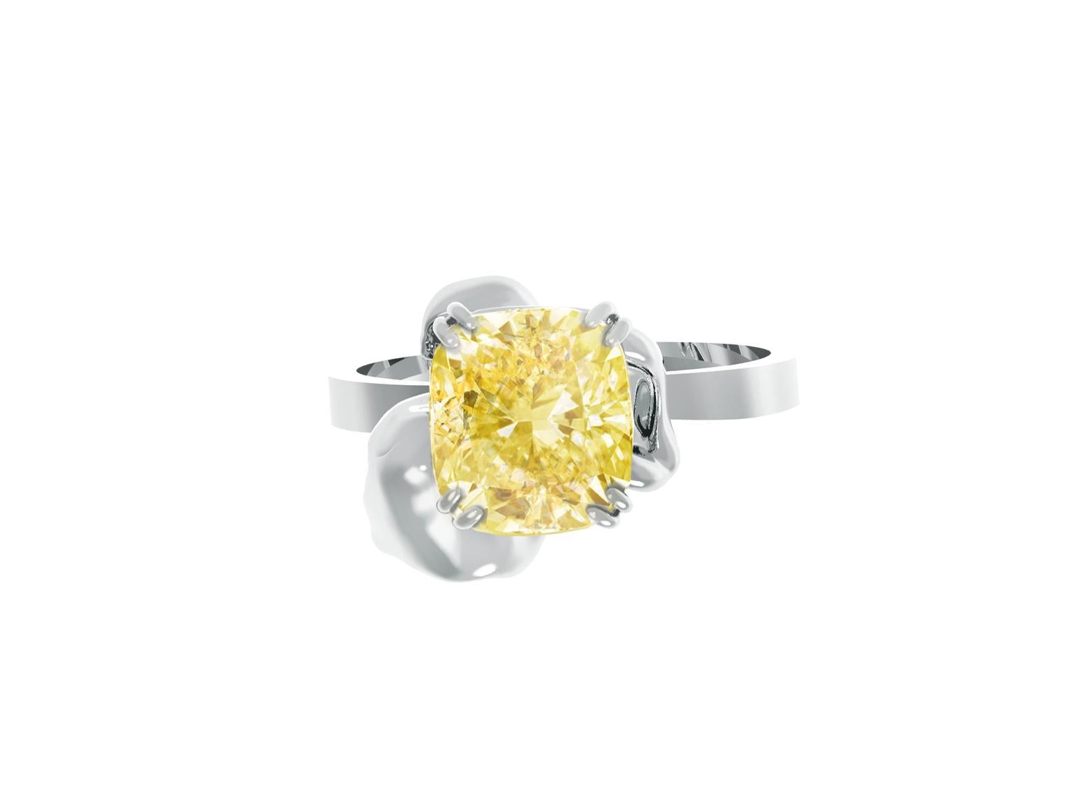 This Flower engagement ring is made of 18 karat white gold and features certified crushed ice cushion cut fancy yellow diamond, weighing 2.2 carats. The certificate for the piece is available upon request. The ring boasts excellent cut work and