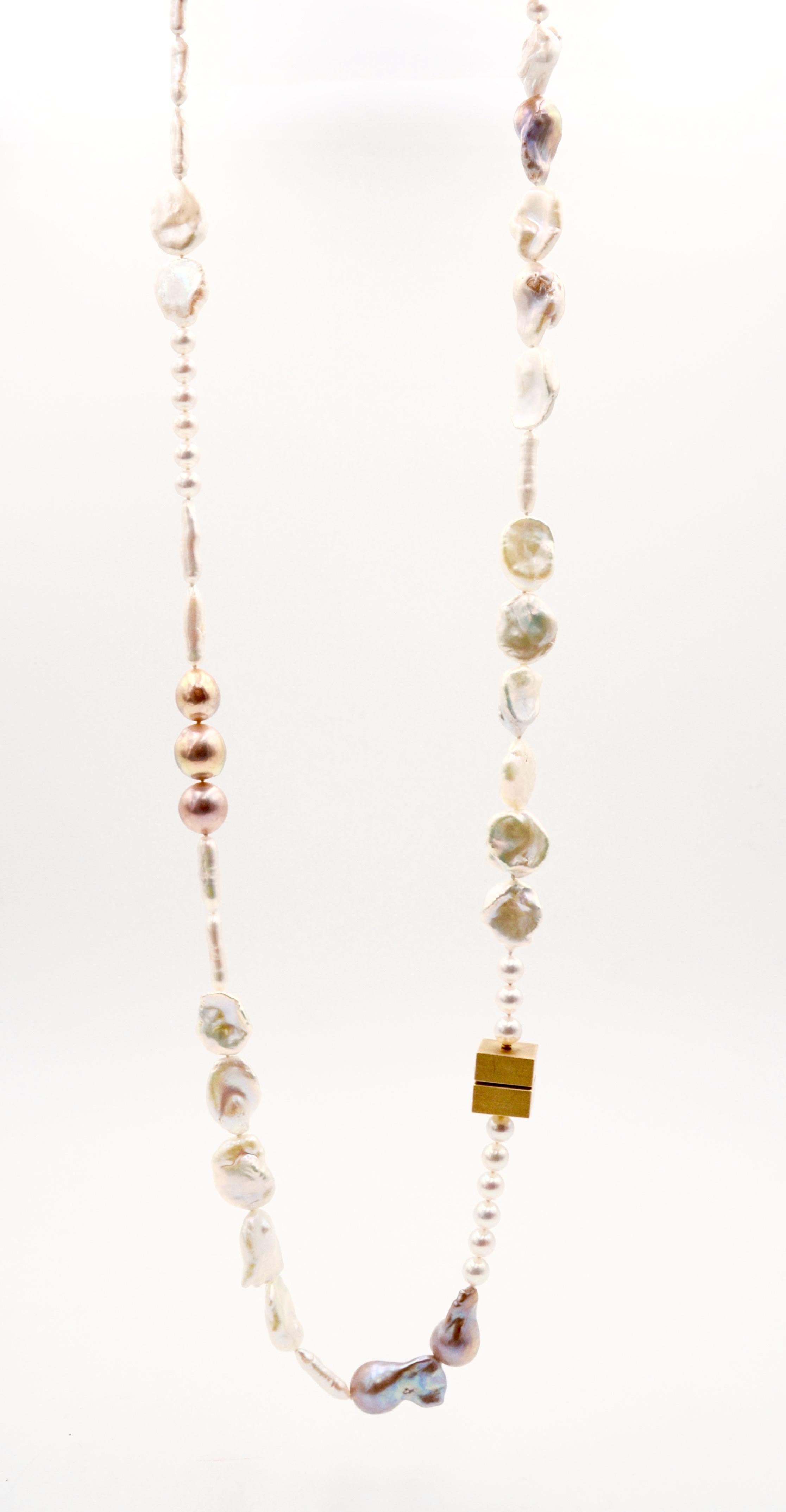 18 karat Gold Fresh Water Pearl Necklace

This creation by Arno Schneider is an exploration of these incredible underwater creations, shimmering Pearls in a variety of frorms and shapes gathering on this long necklace, with the 18 karat Gold cube