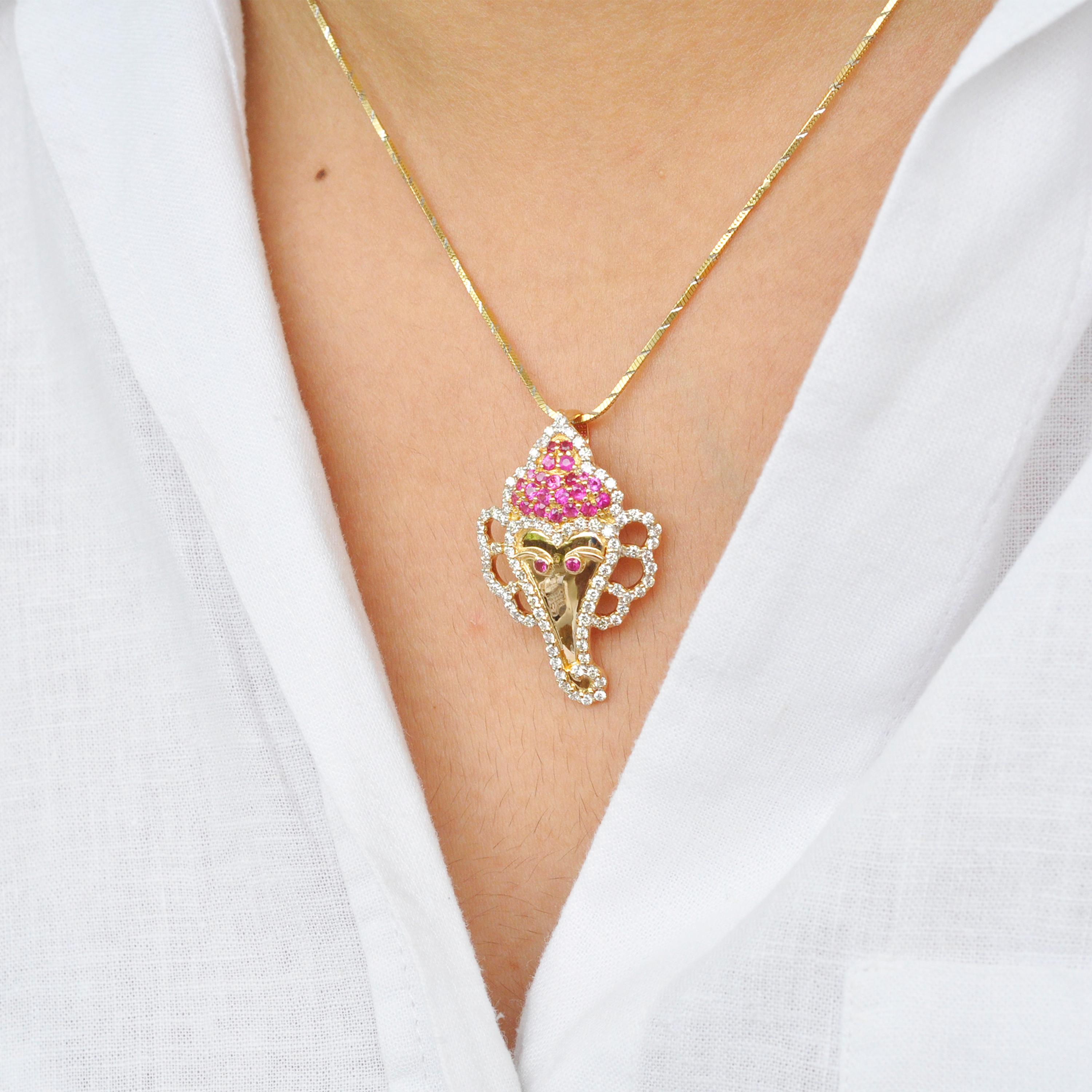 18 karat gold ganesha round ruby diamond pendant necklace.

This pendant is inspired by Lord Ganesha who is the harbinger of good luck and good fortune in India. Lord Ganesha had a face of an elephant, thus so, set in 18 Karat gold. Lustrous round