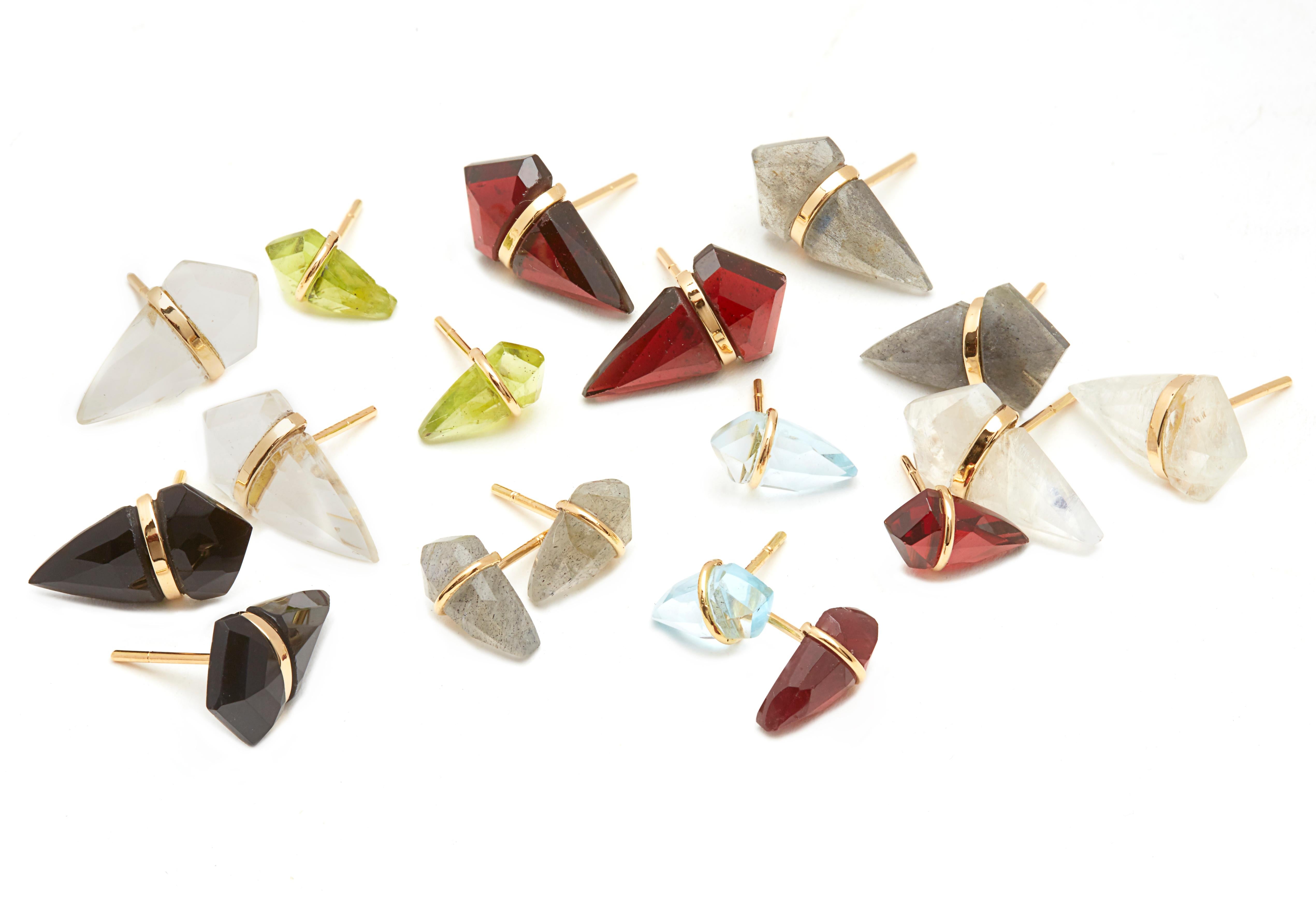 Custom cut garnet kite stones wrapped in 18KT gold.  Signature look by NYC jewelry designer, Page Sargisson.
Last picture of model is to show the size of the earrings.