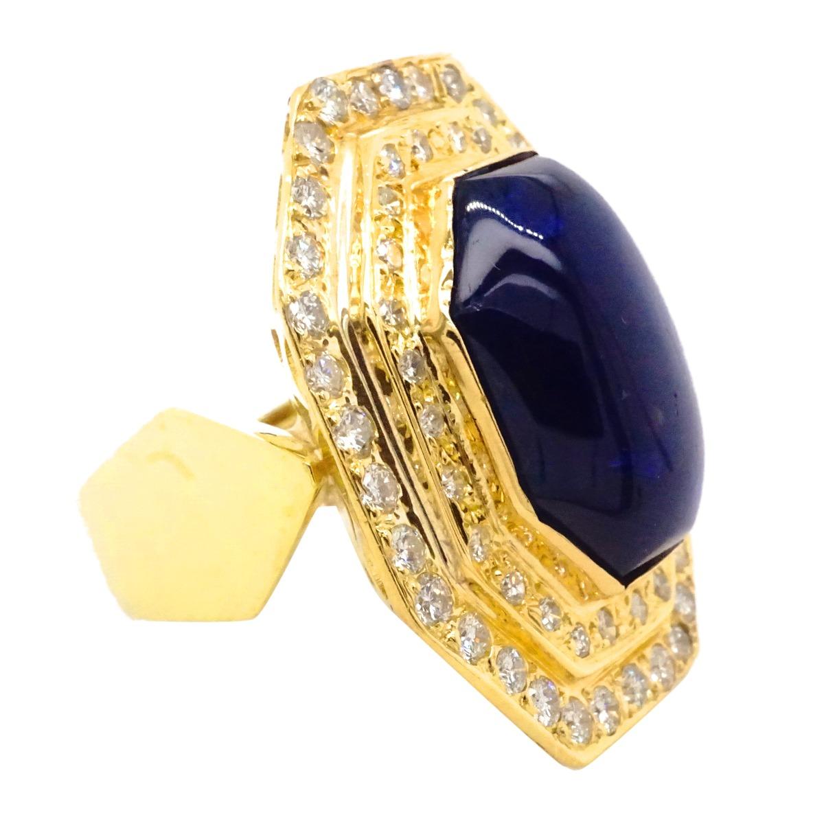 18K Yellow Gold Giant 20CT Blue Sapphire Cabochon Octagon Top Diamond Ring
Metal: 18 K Yellow Gold
Finger Size: 6.5
Gram Weight: 24.3
Diamond Carat Weight: 2.58 CT
Diamond color: H-I
Diamond Clarity: VS1-VS2
Diamond Cut:  Round
Gemstone: