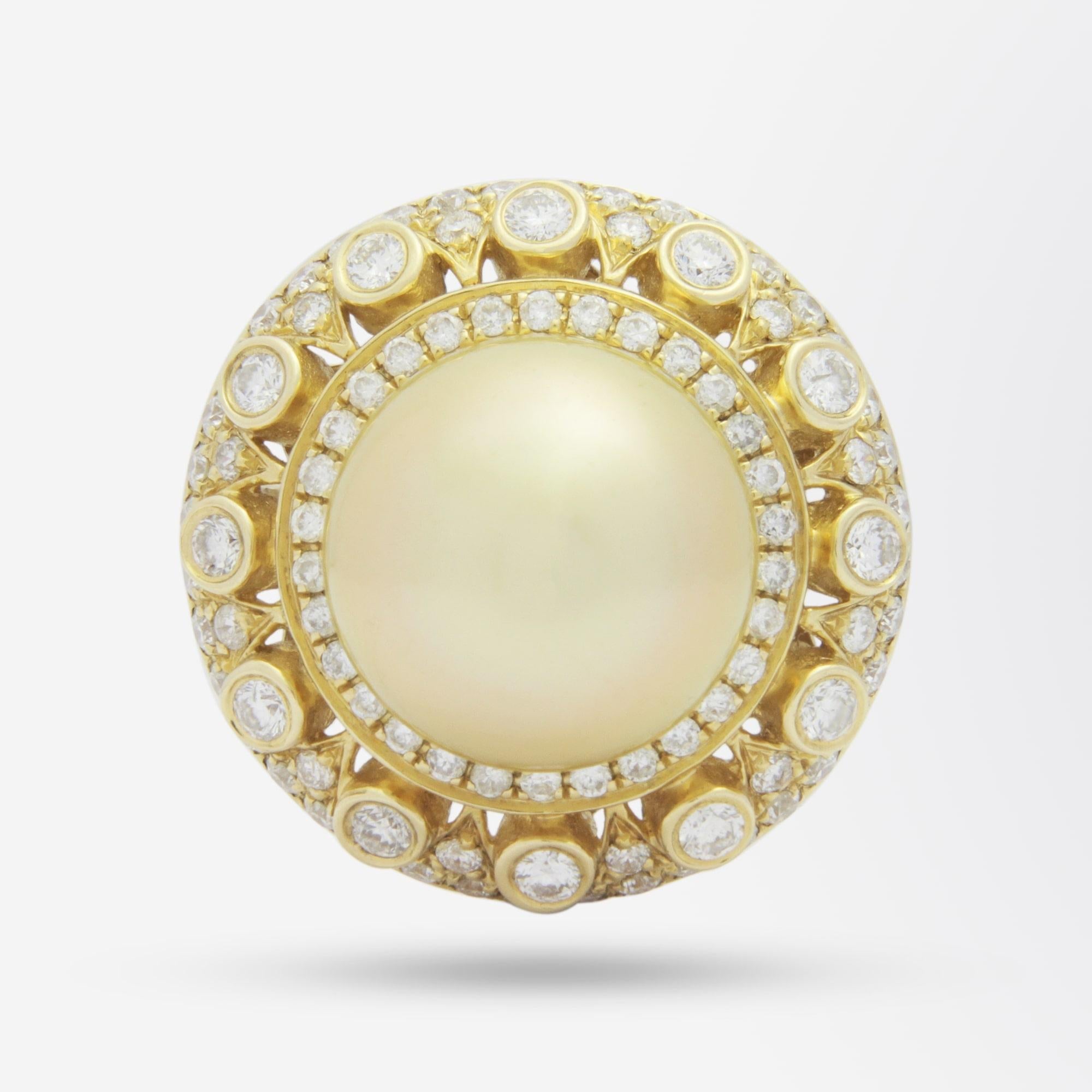 An exceptional ladies dress ring crafted from yellow gold, brilliant cut diamonds and a central golden South Sea Pearl. The ring centres on a 12.13mm round natural cultured South Sea Pearl in a rich gold colour which has been cup and pin set. The