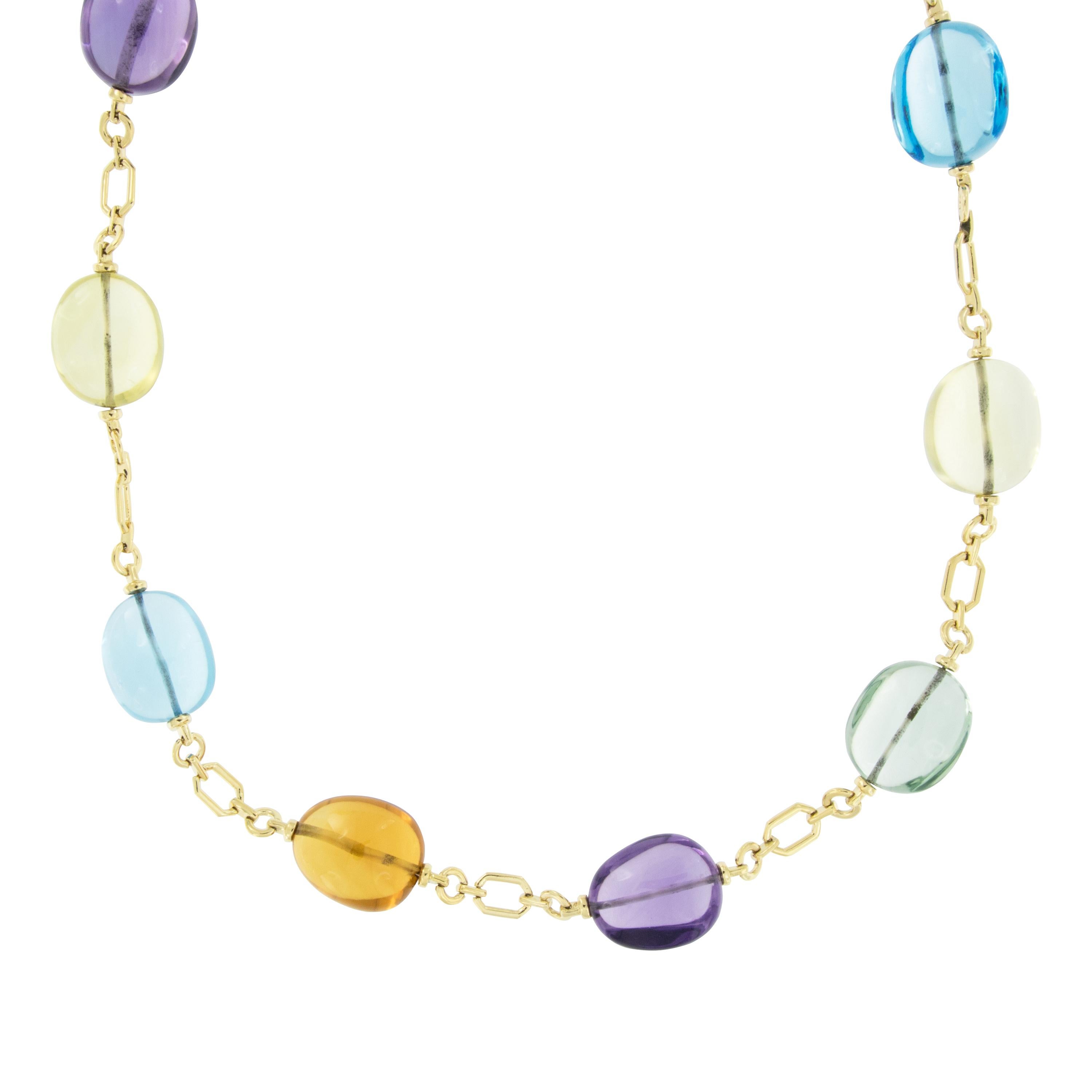 Goshwara, a term for perfect shape, is a company known for exceptional color gems and this necklace exemplifies the term! Softly tumbled shapes in every hue decorates this station necklace with 18 karat yellow gold stylish geometric links in