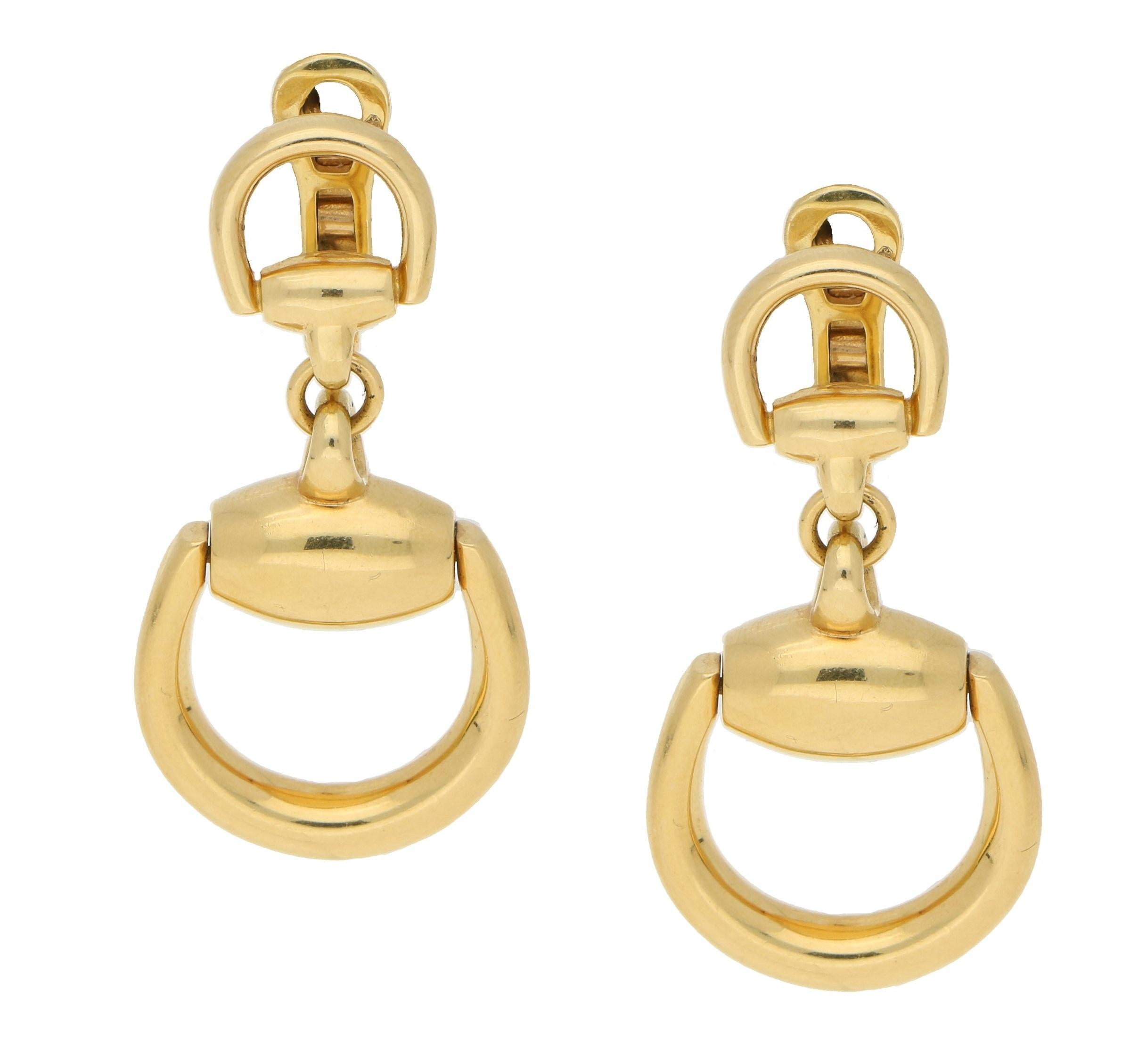  A smart pair of GUCCI signed stirrup design earrings. These are fully hallmarked, 'GUCCI' 'made in Italy', they also carry the hallmark for 18 karat gold '750'. These are in great condition and are very comfortable to wear. They measure 42mm length