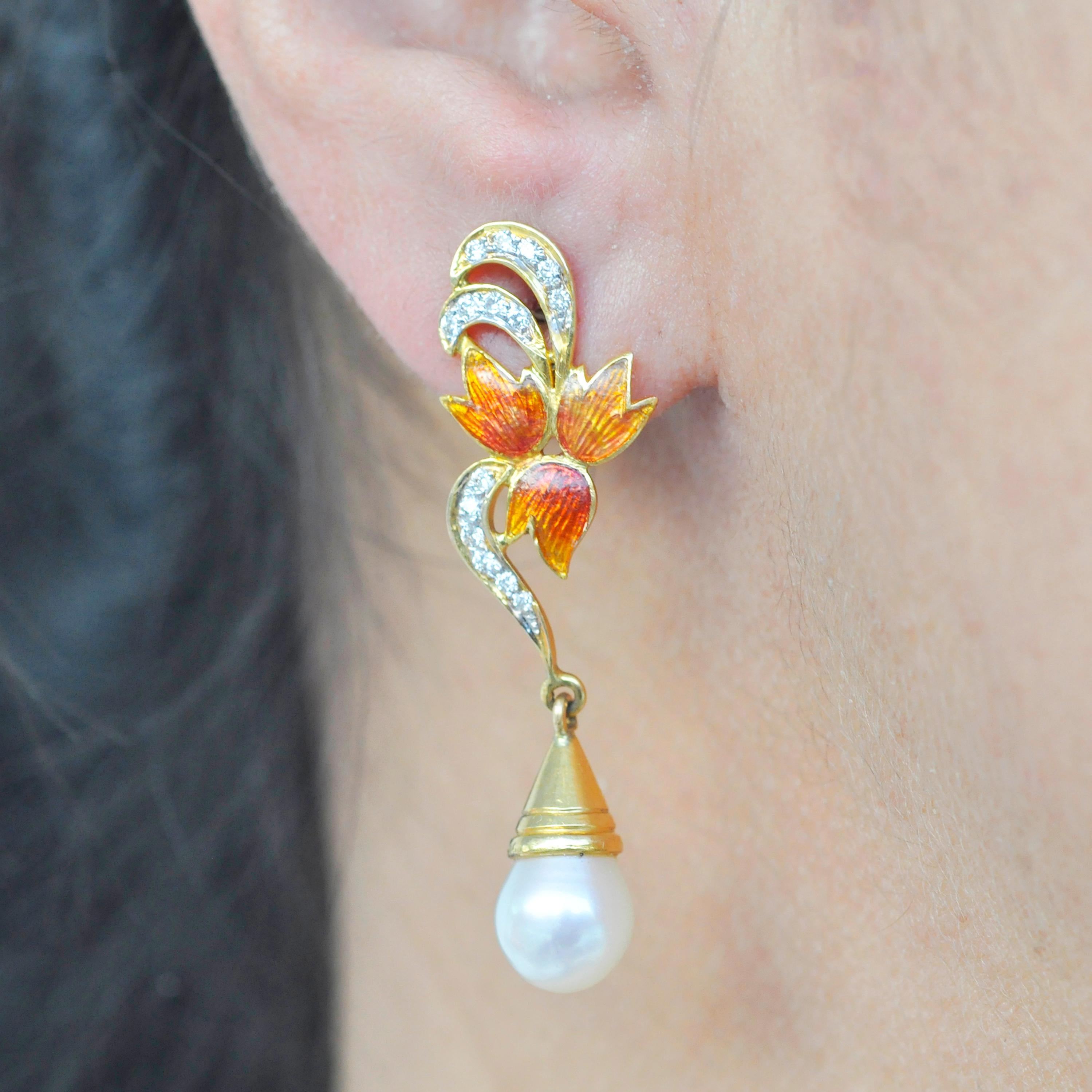 18 karat yellow gold autumn maple leaf guilloché french enamel diamond pearl dangle drop earrings

These elegant earrings captures the beauty of autumn. The beauty of these dangle drop earrings lies in the gradation from dark to light orange using