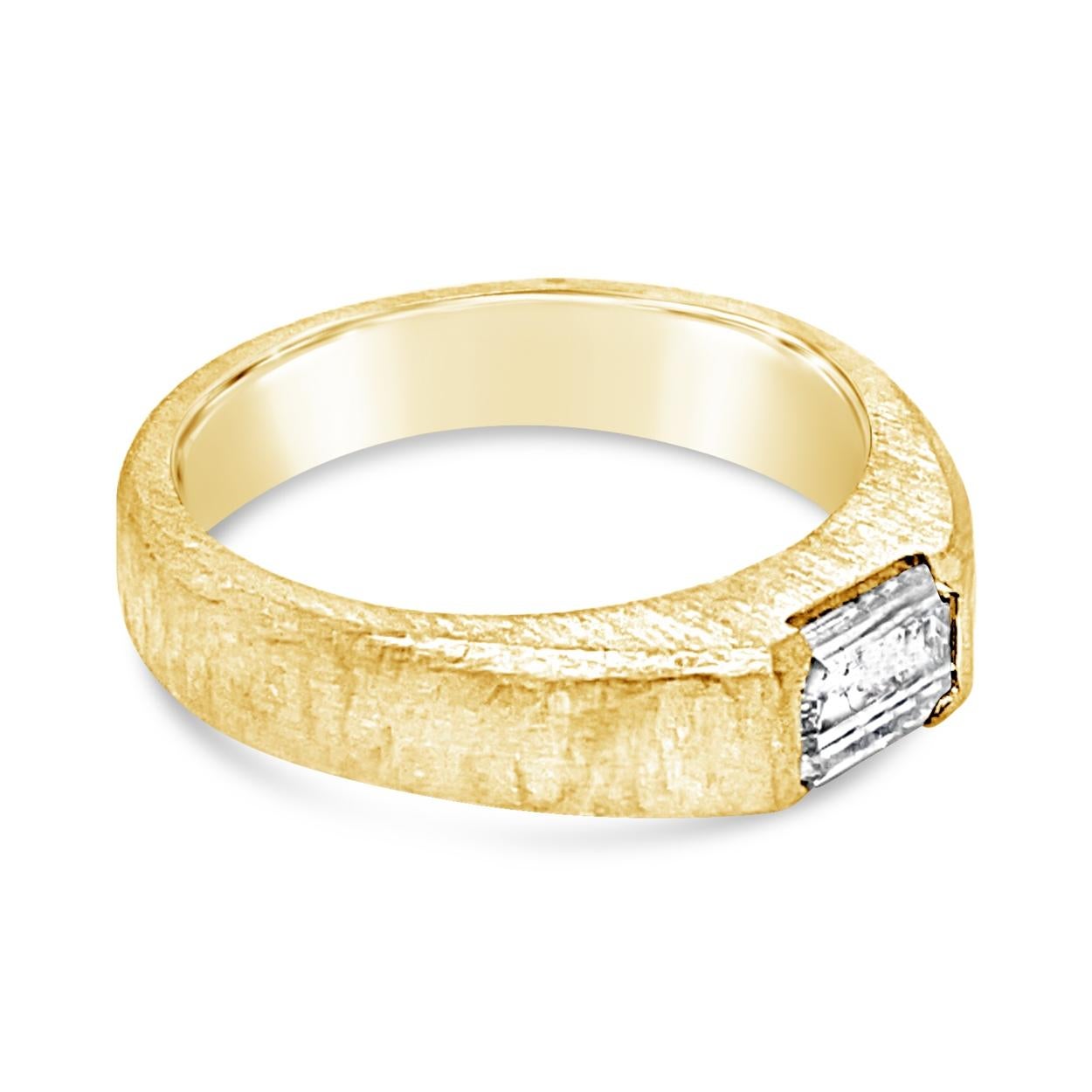 This Hand hammered Solitaire Ring is made in 18K Yellow Gold and hosts an EGL certified  1.02 Ct Emerald Cut natural diamond channel set in its center.
Center stone: 1.02 Ct Emerald cut diamond
Dimension: 7.13x4.73x3.33