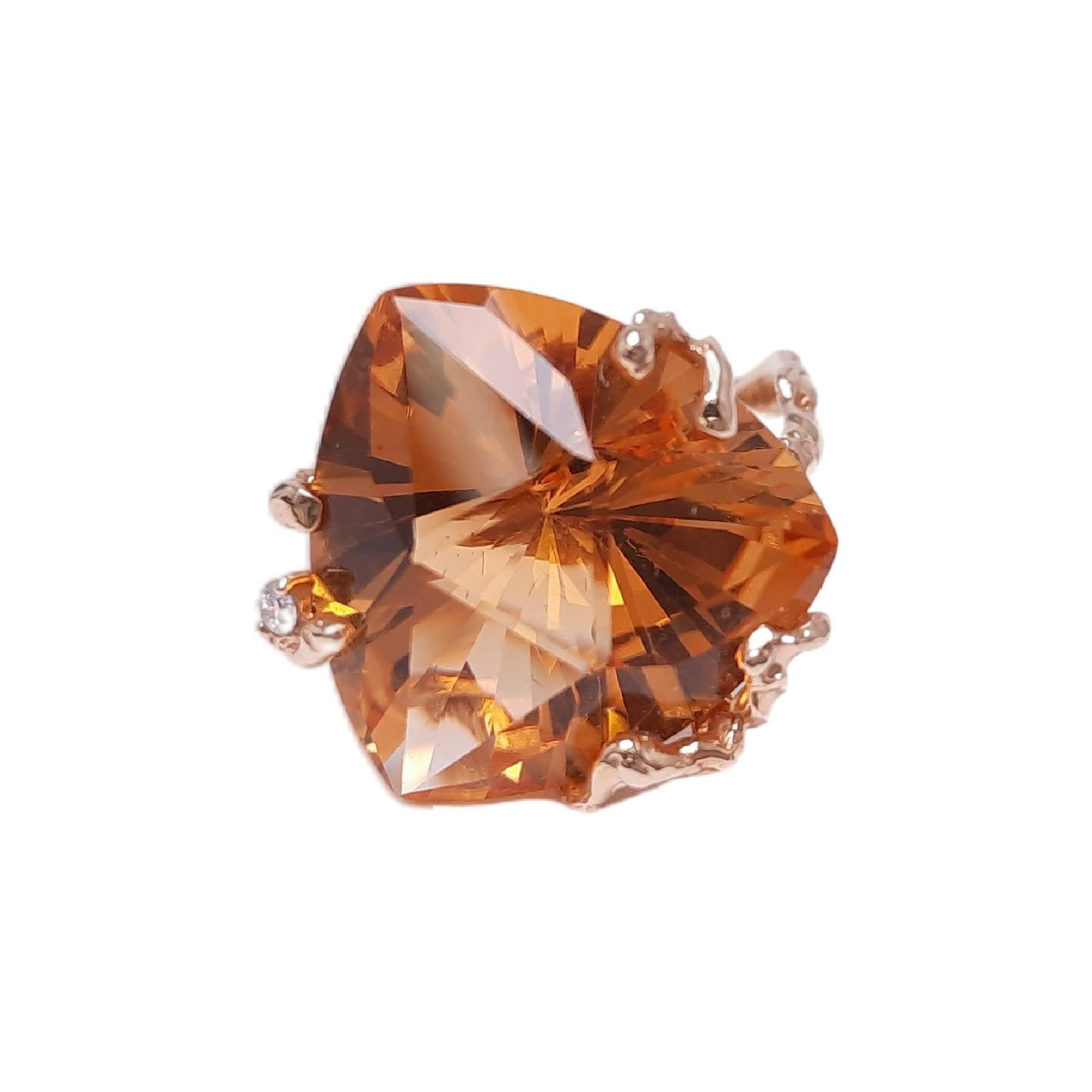 Citrine, which has a sun-like warm colour, is the best symbol representing the wealth, luck, and success. 20ct vivid citrine sits on the twig-like sophisticated gold frame, emphasizing its stone's bright color and power. The spark of diamonds gives