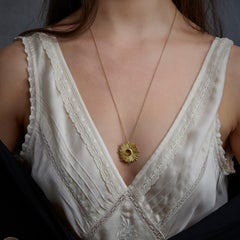 18 Karat Gold Handmade Sunburst Pendant Hanging on a 18 Karat Gold Chain