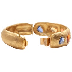 18 Karat Gold Hinge Bangle Bracelet with Blue and Pink Sapphires