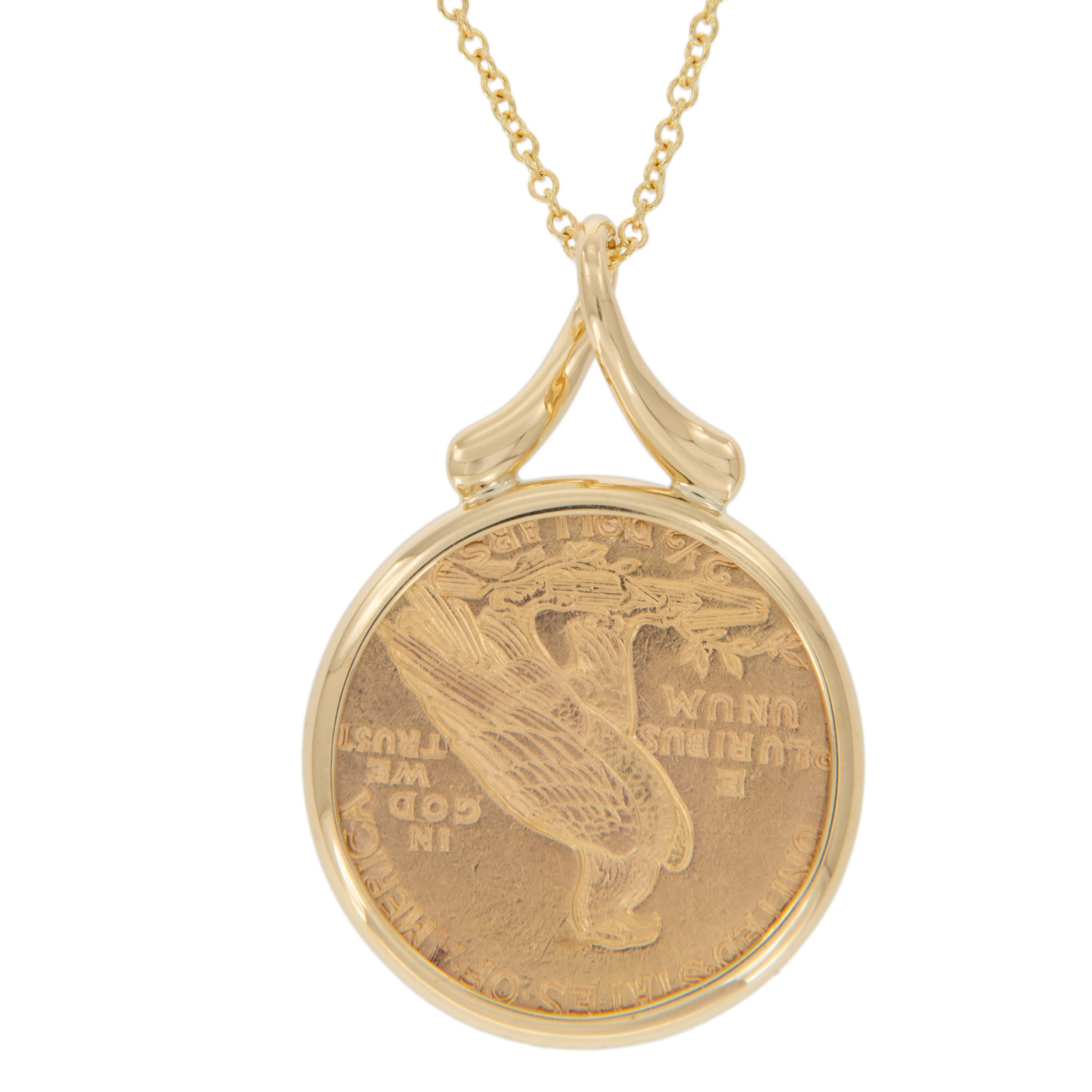 Enjoy a piece of American gold coin history! This 1913 $2.50 Indian head quarter eagle coin is framed by designer Michael Bondanza in 18k yellow gold and suspends from a diamond accented ribbon-style bail on a 16-inch chain. Pendant measures 27.5mm