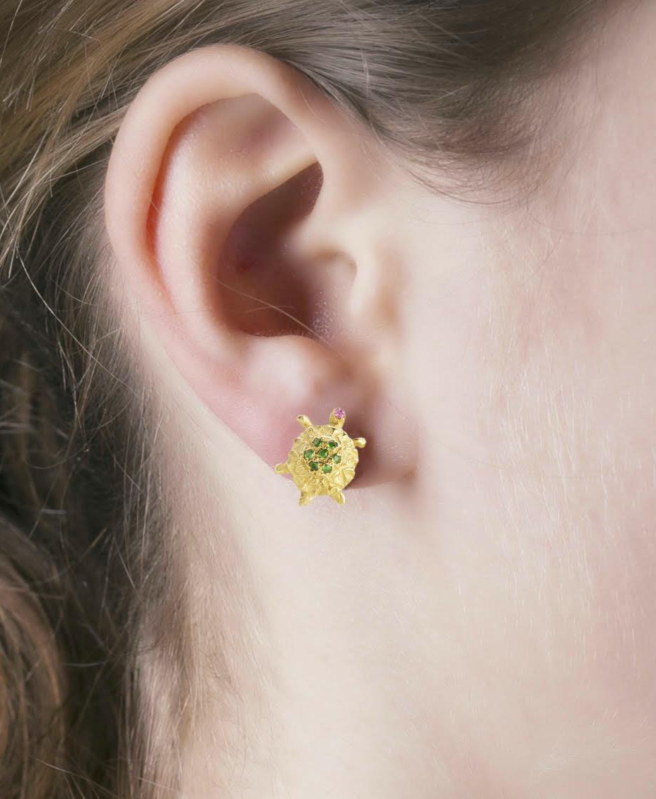 Rossella Ugolini Design collection, a pair of Little Turtles Stud Earrings handcrafted in 18 Karats Yellow Gold and adorned with a beautiful deep green tsavorites  and pink tourmalines. Designed to be worn with joy, the colors of the earrings are