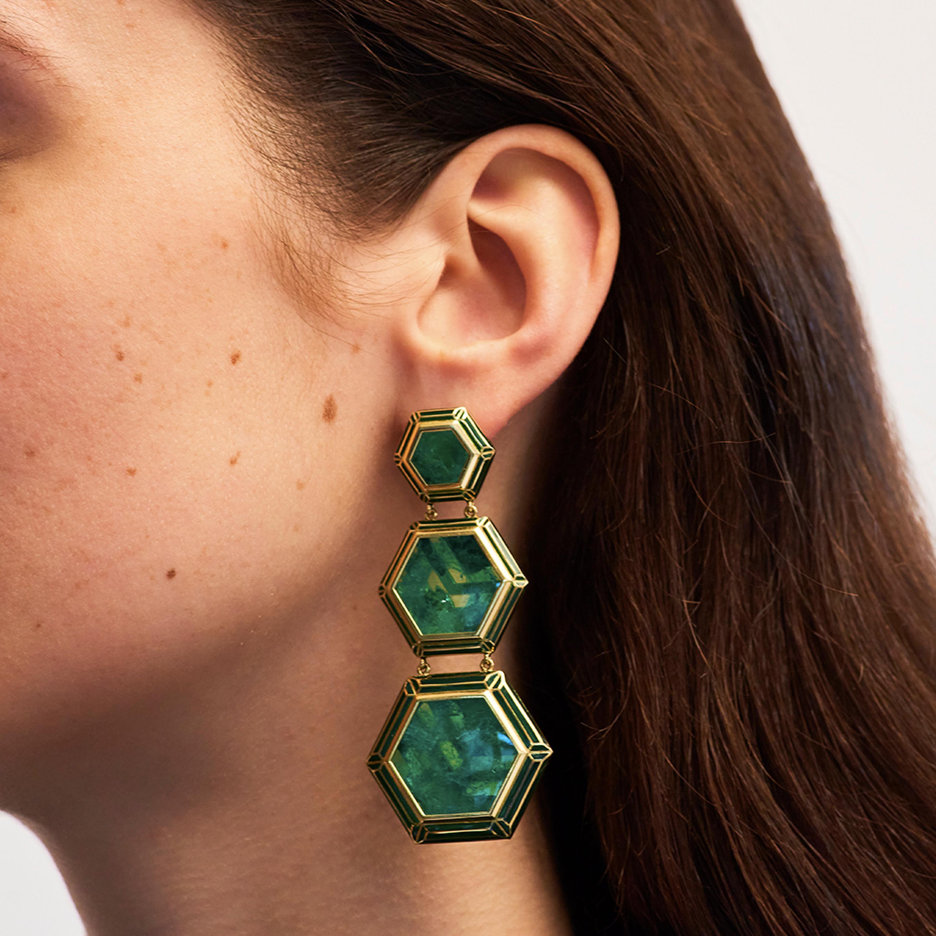 Alice Cicolini's vibrant Muzo Emerald Jaipur Bouganvillea Earrings are made in 18k yellow gold. One-of-a-kind, these jewels are hand painted with lacquer enamel by London-based master craftsmen Alan O’Grady, Stanislav Reymer. They are set with Muzo