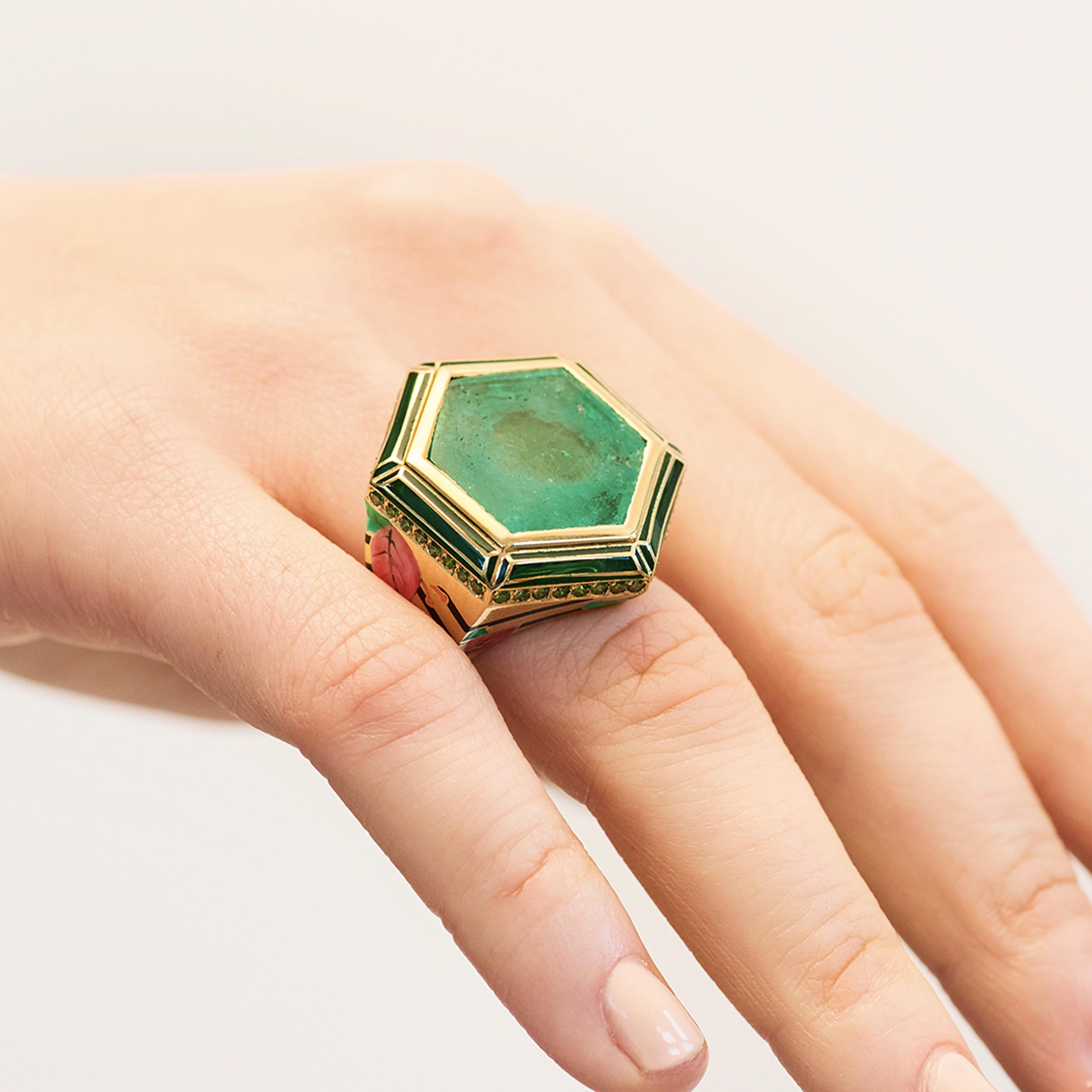 British designer Alice Cicolini's Jaipur Bouganvillea Muzo Emerald Ring is a stunning cocktail ring crafted from from 18k yellow gold. The ring is hand painted in London with lacquer enamel, and is set with a Muzo trapiche emerald (13.26ct) and