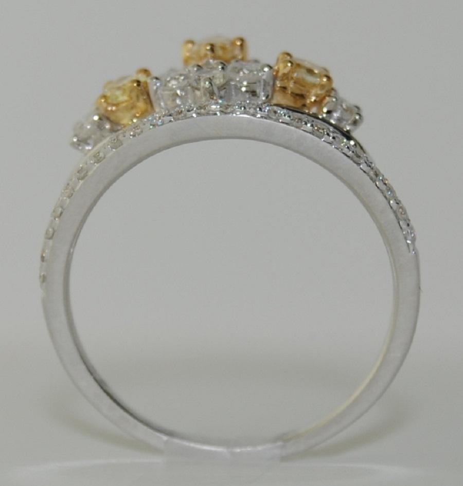 Ladies Diamond Ring with Oval Fancy Diamond/Yellow and Round White Diamonds total weight 0.95 Carats, made of 18 Karat White Gold, Size 6.75  