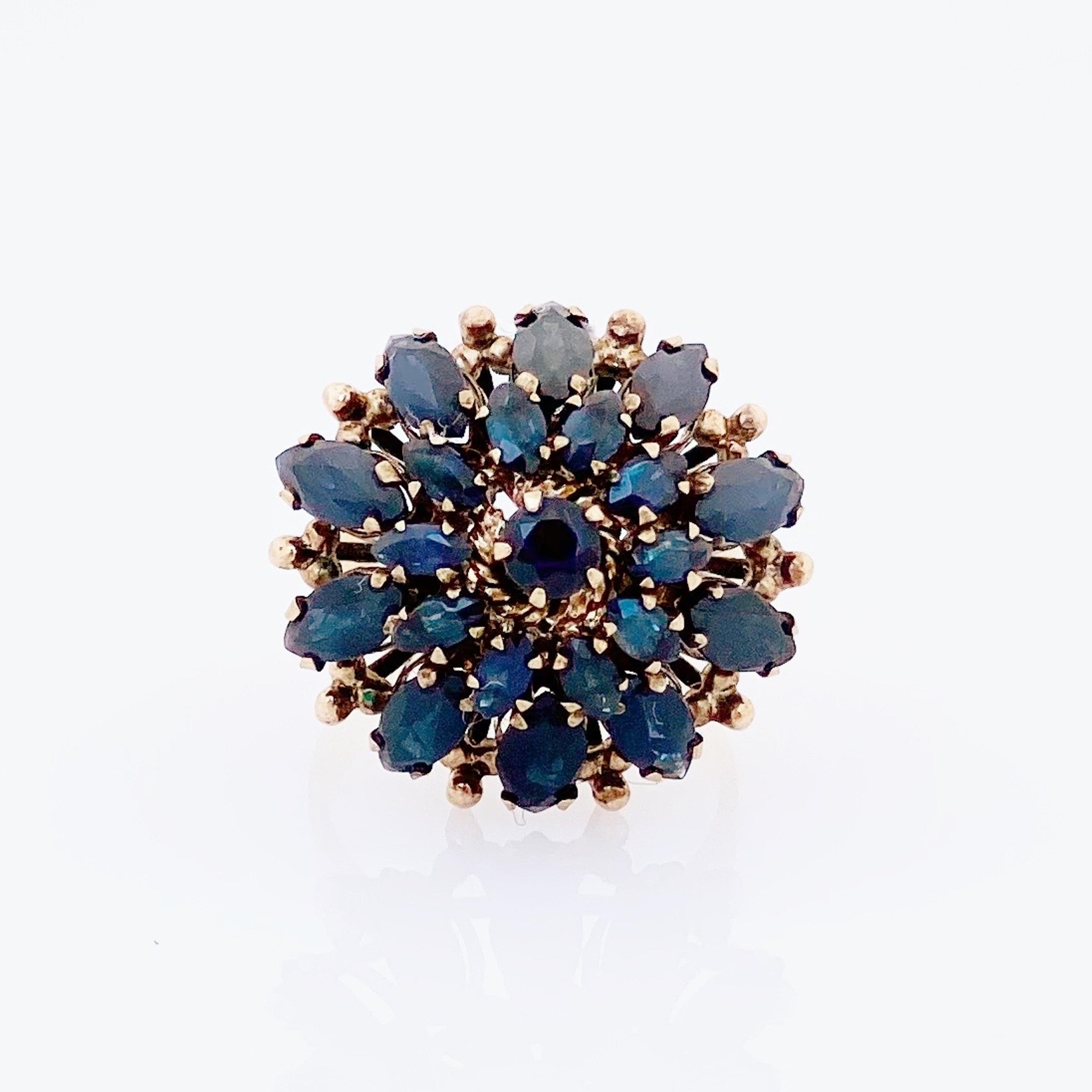 - Vintage item

- Size 5

- 18k gold (stamped on interior)

- Marquise and round cut faceted Sapphire gemstones

- Circa 1960s

- Estate acquired

- Excellent vintage condition 