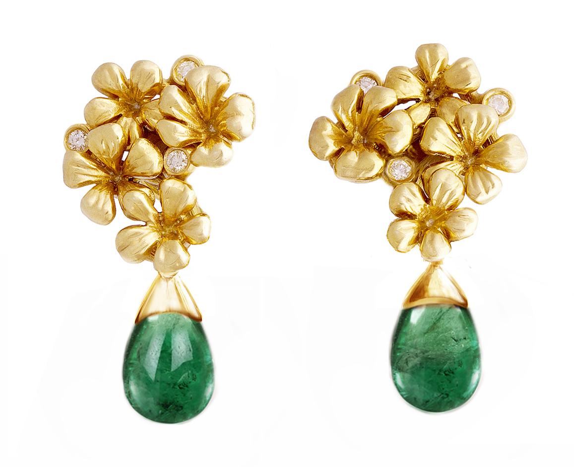 These clip-on contemporary earrings are made of 18-karat yellow gold and are adorned with six round diamonds and natural cabochon removable emeralds. The drops can be taken on or off, making the earrings versatile as you can replace the cabochon