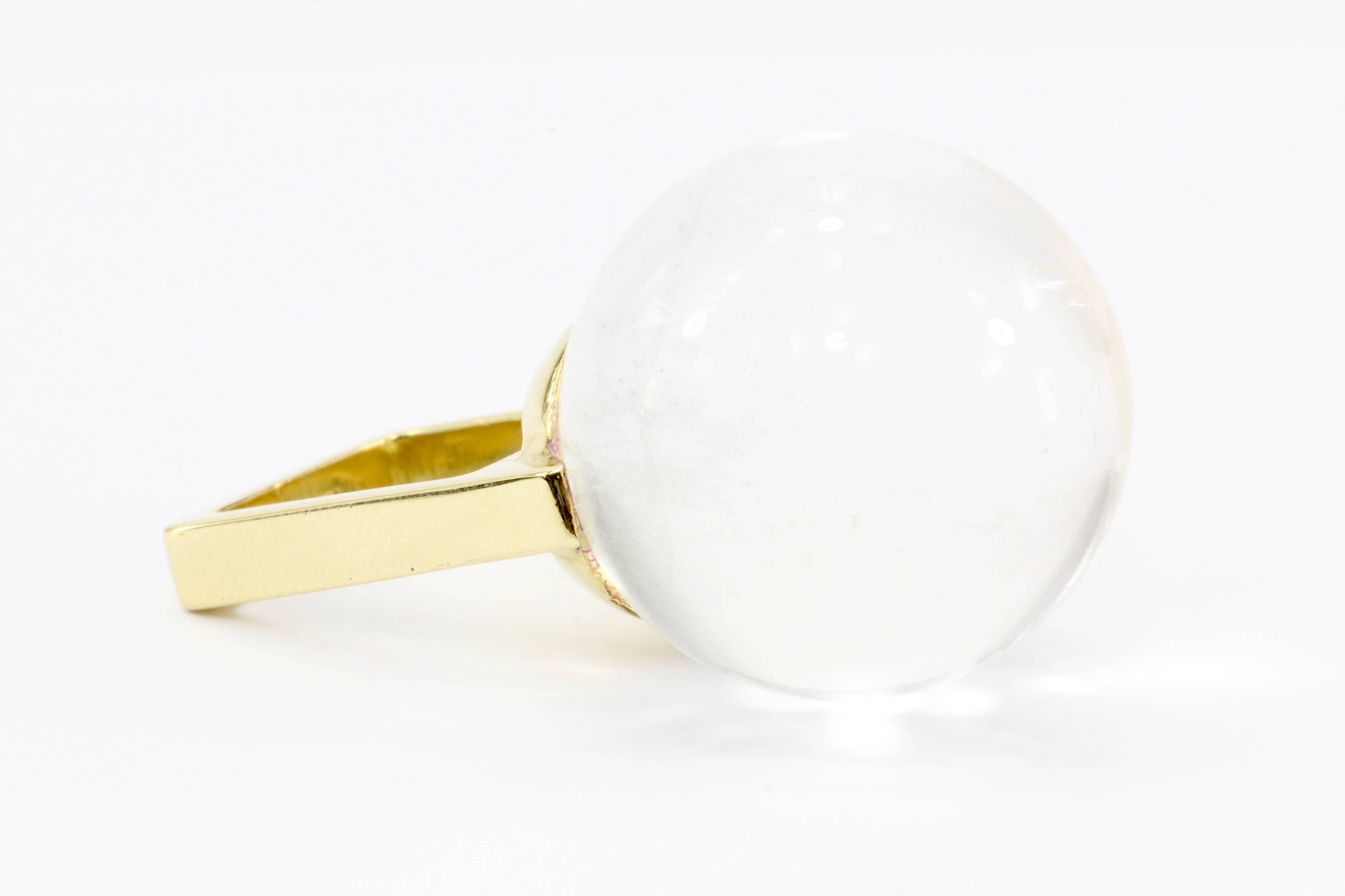 Era: c.1970's

Hallmarks: 18K

Composition: 18K Yellow Gold

Primary Stone: Clear Rock Crystal Quartz

Dimensions: approximately 25mm diameter

Shape: Spherical 

Ring Width: 25mm

Rise Above Finger: 28mm

Ring Size: 4 / 4.25 (square band)

Ring