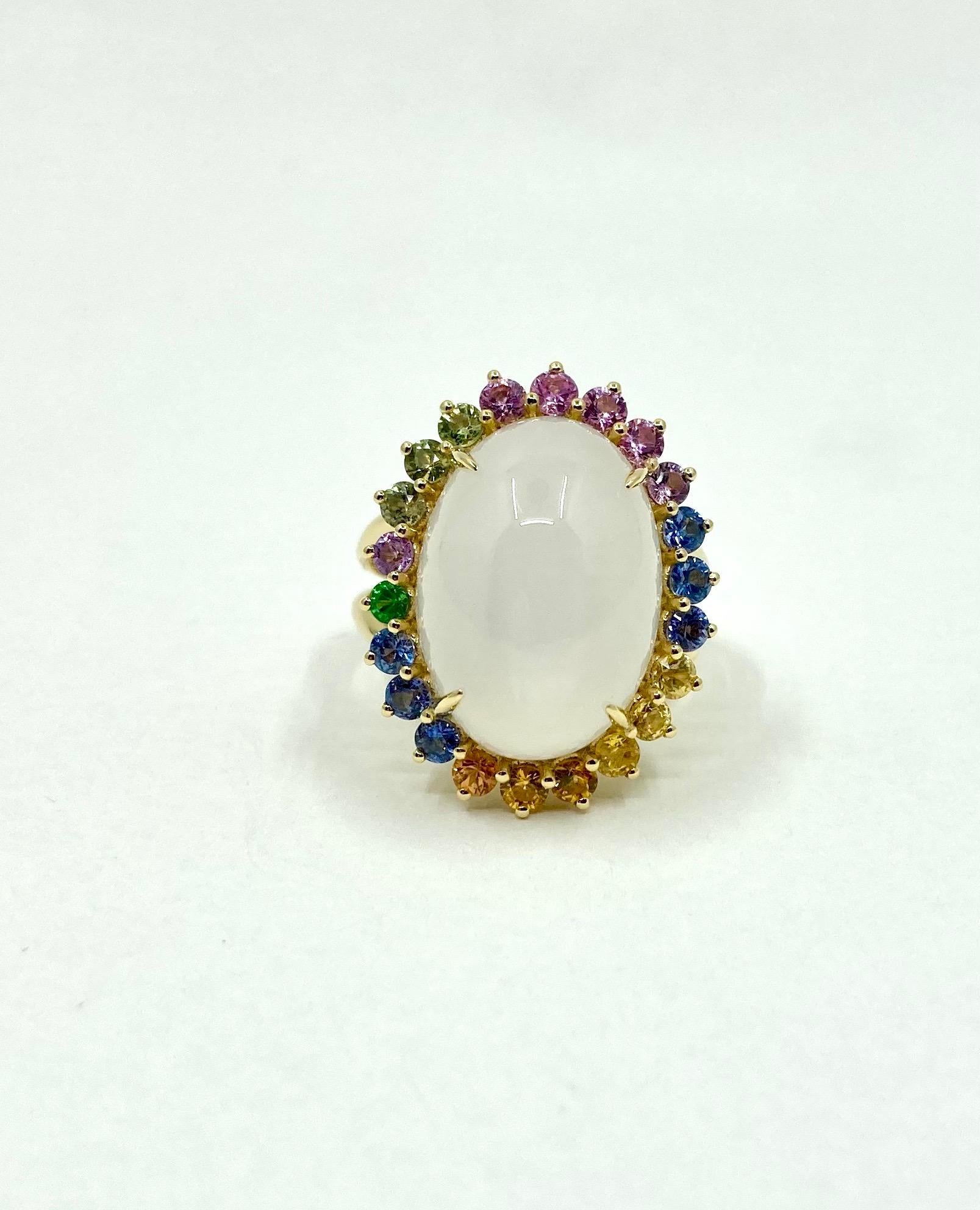 Timeless elengat Yellow Gold Ring, with a central White Moonstone ct. 14.55 and Multicolor Sapphires (Blue, Green, Orange, Purple) ct. 1.73, Made in Italy by Roberto Casarin. 

Size: 15 (7 1/4 USA)

A simple yet refined design, this ring is perfect