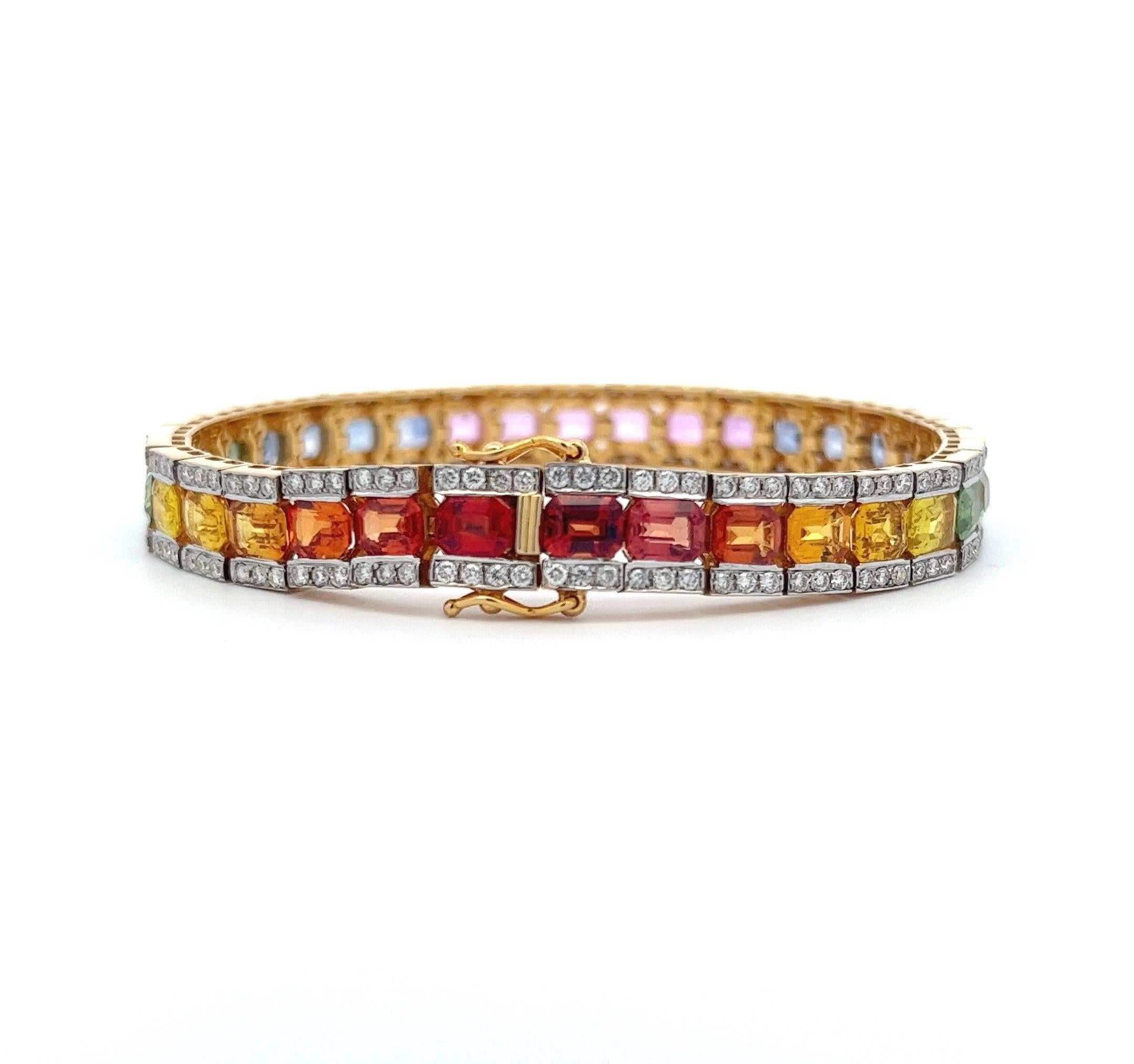 This multi-color graduated sapphire and diamond bracelet is a truly luxurious and highly collectible piece of jewelry, designed to captivate and delight the senses. With a total of 204 diamonds, amounting to 4.08 carats, and 34 sapphires, totaling