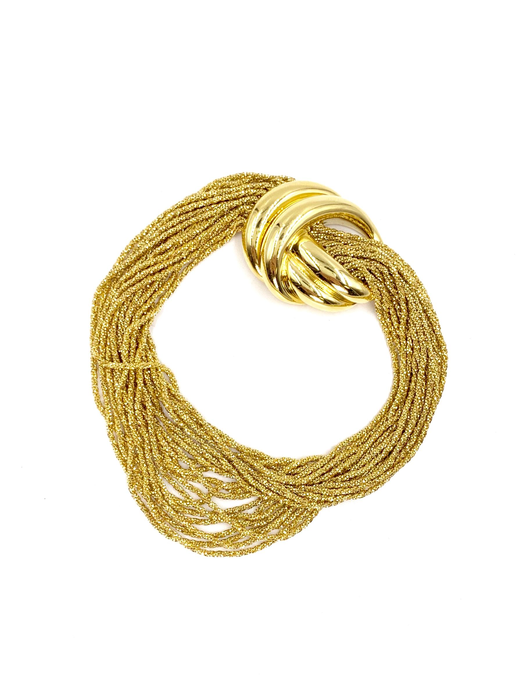 This stunning bracelet features Yuri Ichihashi's marvelous 'silken gold' texture on the glistening and luxurious 20 golden strands which gracefully cascade from each end of the polished golden knot style clasp. This beautiful piece will live up to