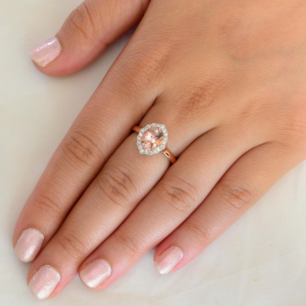 A beautifully crafted solid 18 carat rose gold ring featuring a quality 1.80 carat morganite adorned with 20 diamonds in an alluring  halo setting. The morganite is natural and earth mined and is an eye pleasing salmon pink in colour with a lovely