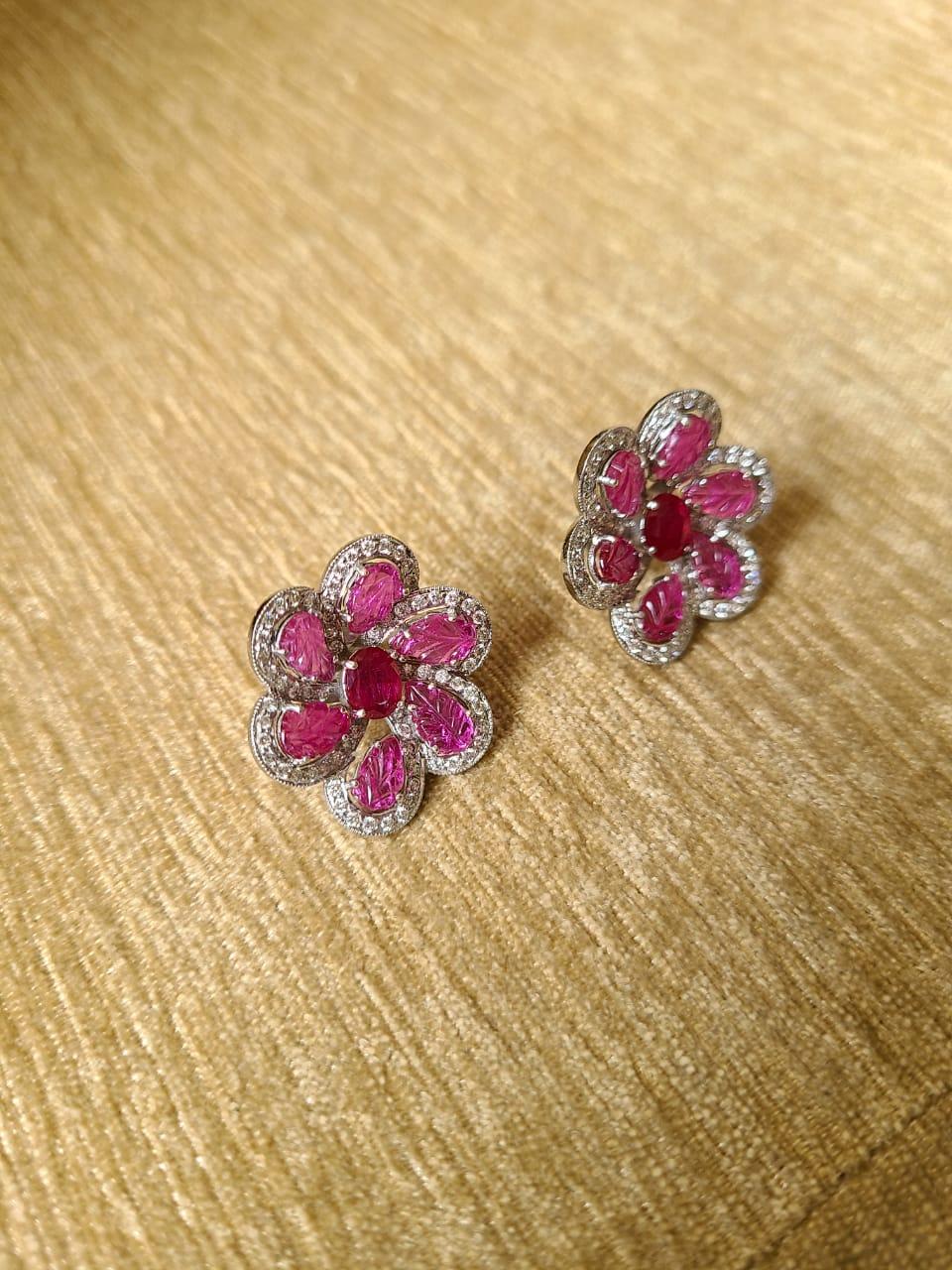 A very gorgeous and wearable pair of Ruby and Diamond Stud Earrings set in 18K Gold. The combined weight of the Rubies is 6.09 carats. The Rubies are completely natural without any treatment, and are of Mozambique origin. The weight of the Diamonds
