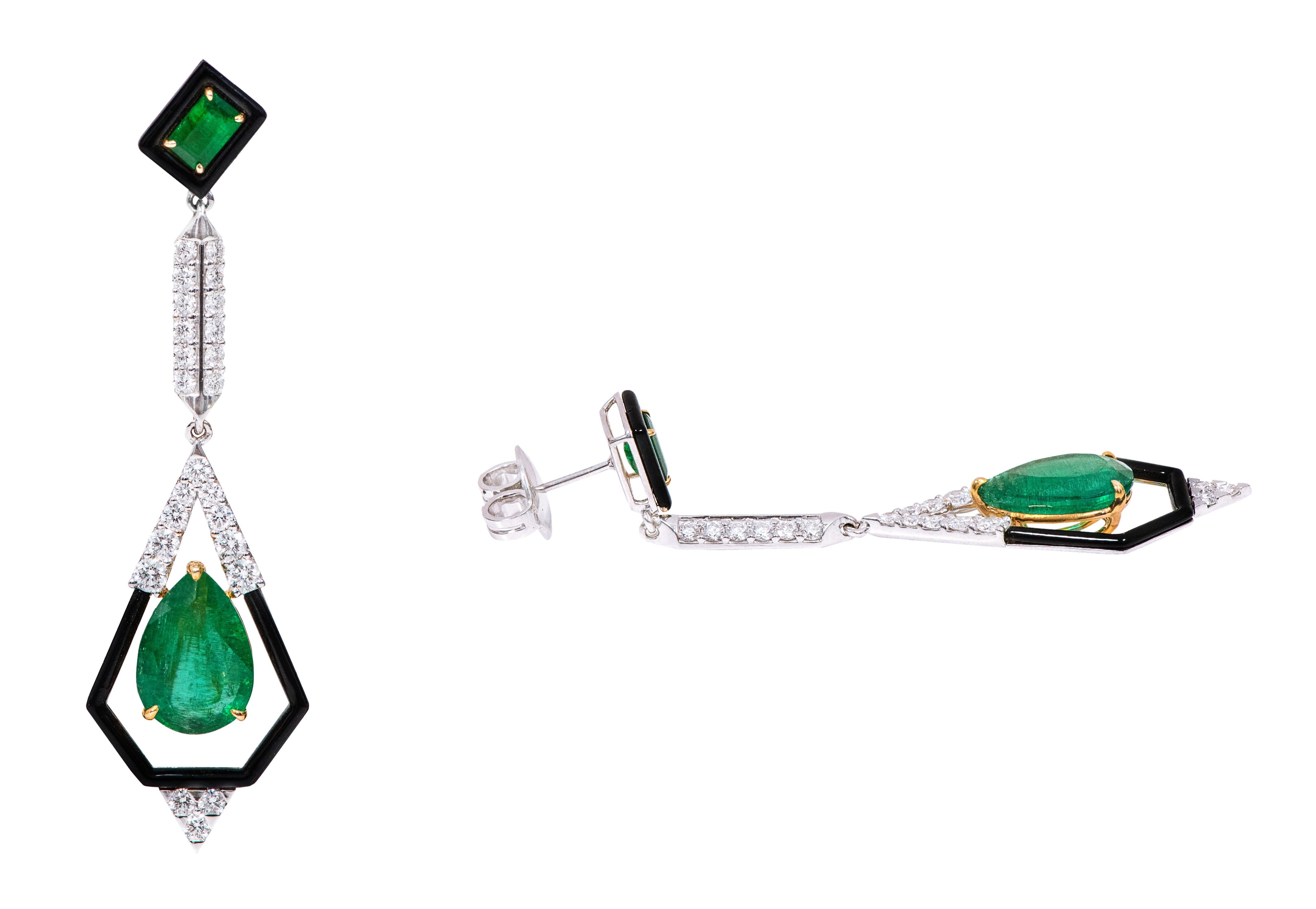 18 Karat Gold Natural Emerald, Diamond, and Black Enamel Dangle Earrings

This impeccable shamrock green emerald and diamond earring pair is exceptional. The pear shaped solitaire emerald in the center is exemplified with a pentagonal shaped gold