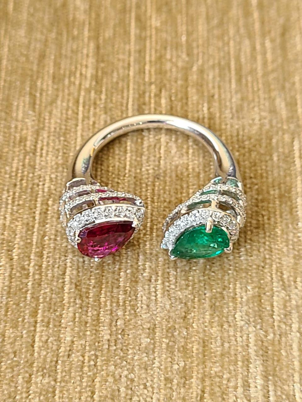 A very gorgeous and wearable Emerald and Rubilite Cocktail Ring set in 18K Gold & Diamonds. The weight of the Emerald is 1.12 carats. The Emerald is completely natural, without any treatment and is of Zambian origin. The weight of the Rubilite is