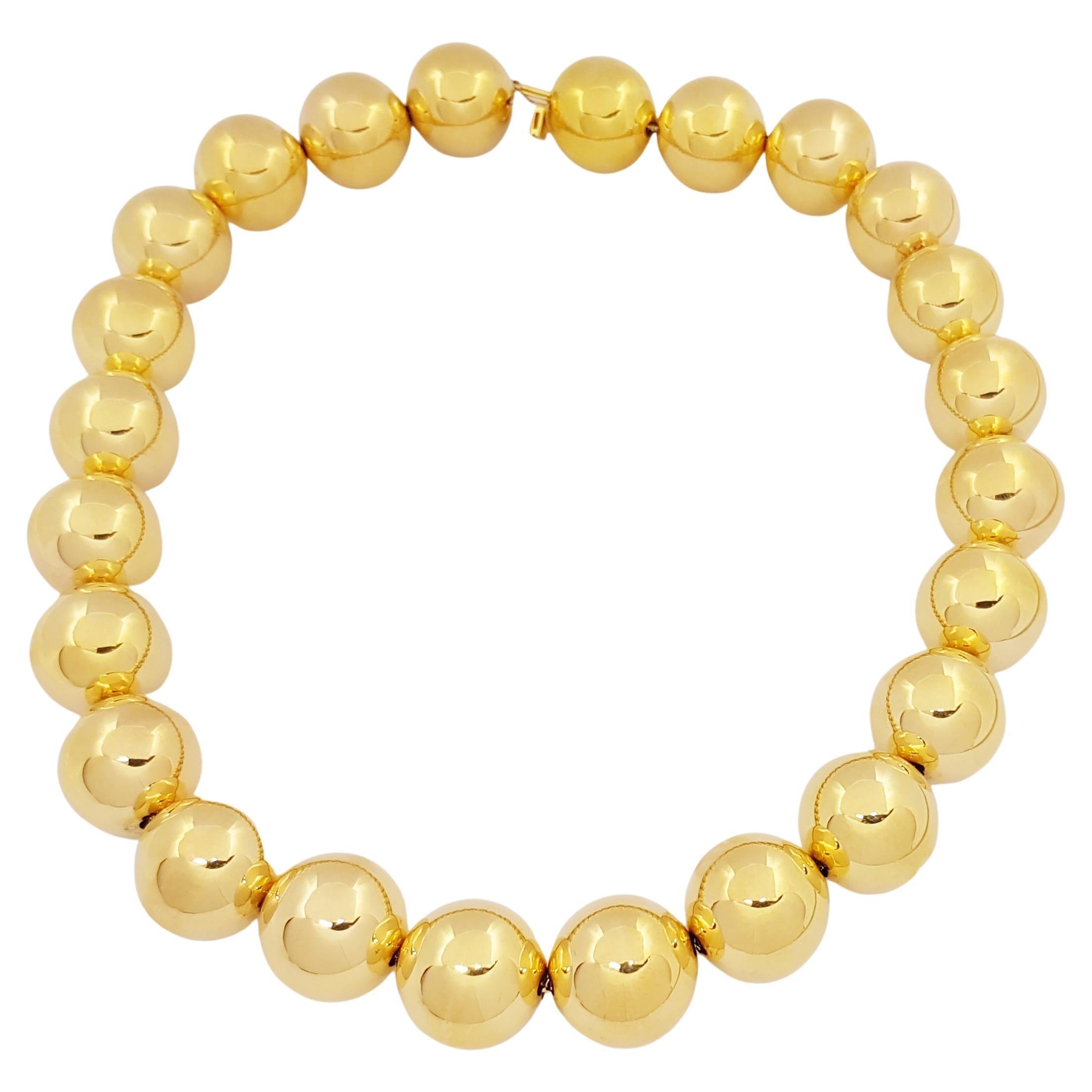 18 Karat Gold Necklace

Width: 2.0 cm 
Length: 48.0 cm
Total Weight: 145.78 grams

Gold Ball: 20 mm/24 pcs

