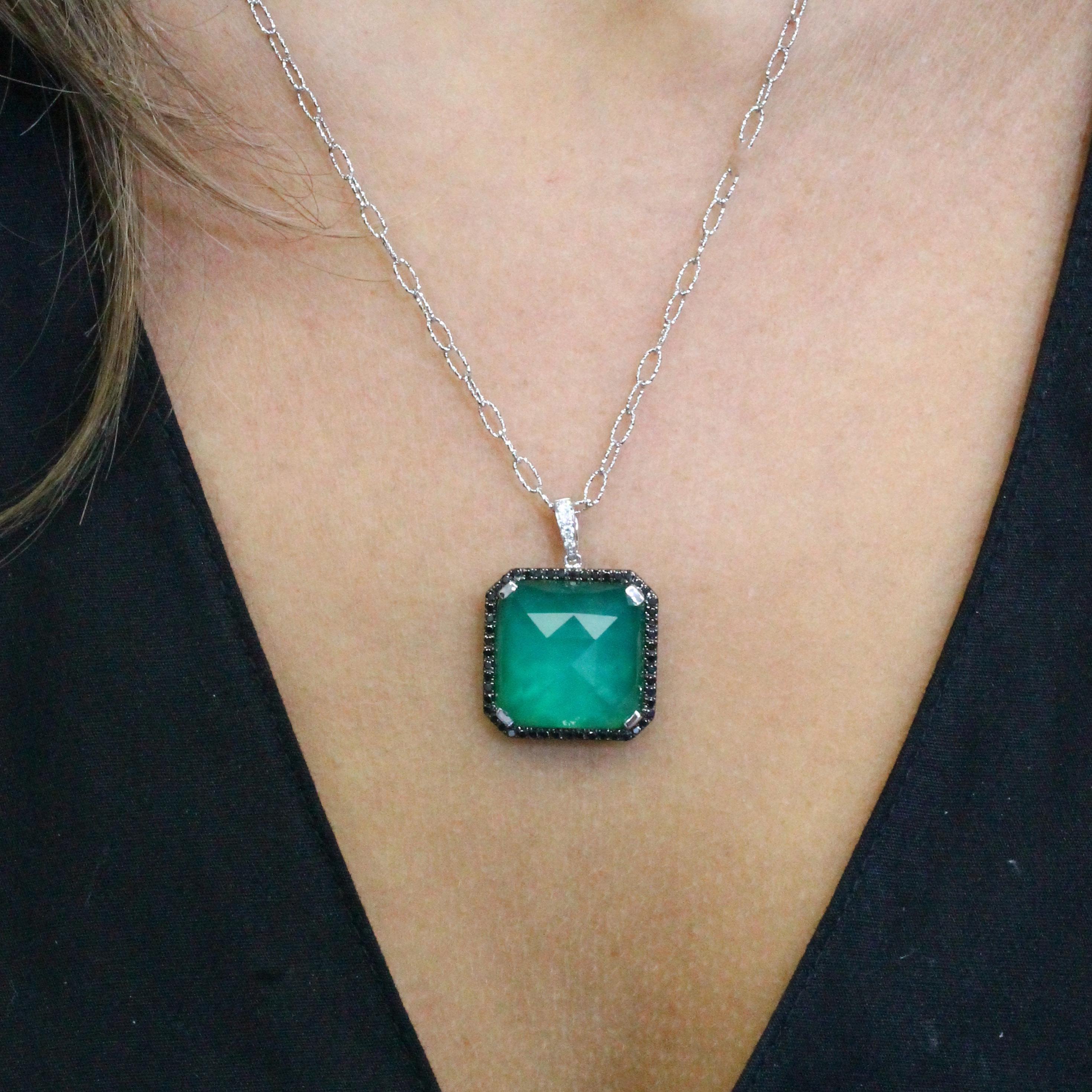 One-of-a-kind Pendant featuring Cushion Checker-Cut White Topaz layered with Green Agate, set in 18 Karat White Gold. Black Diamonds Surround the center stone. Hangs from an 18K 18-inch Italian Handmade Textured Link Chain. Doves master artisans
