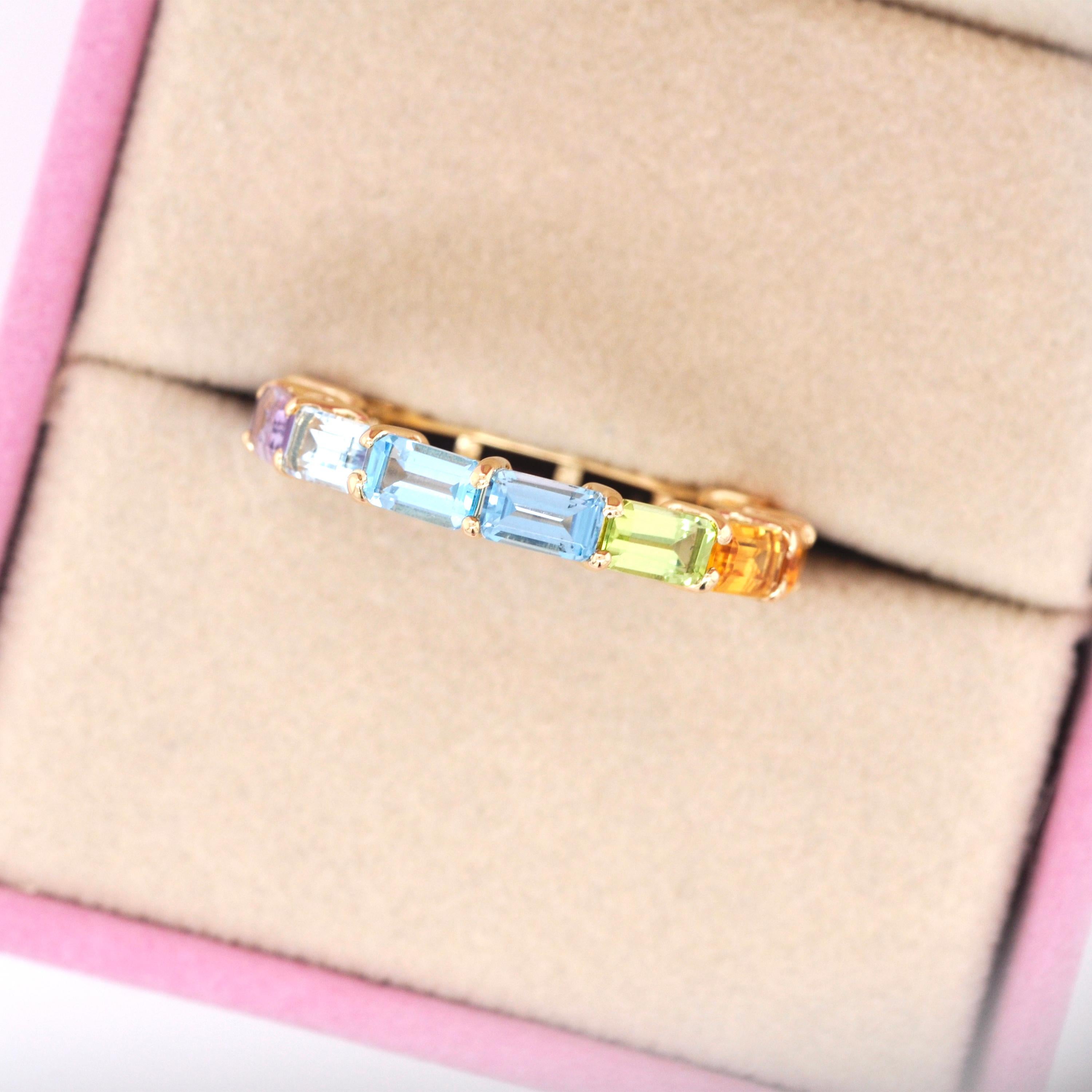 For Sale:  18 Karat Gold Octagon Multicolor Rainbow Gemstones Prong Set Eternity Band Ring 6