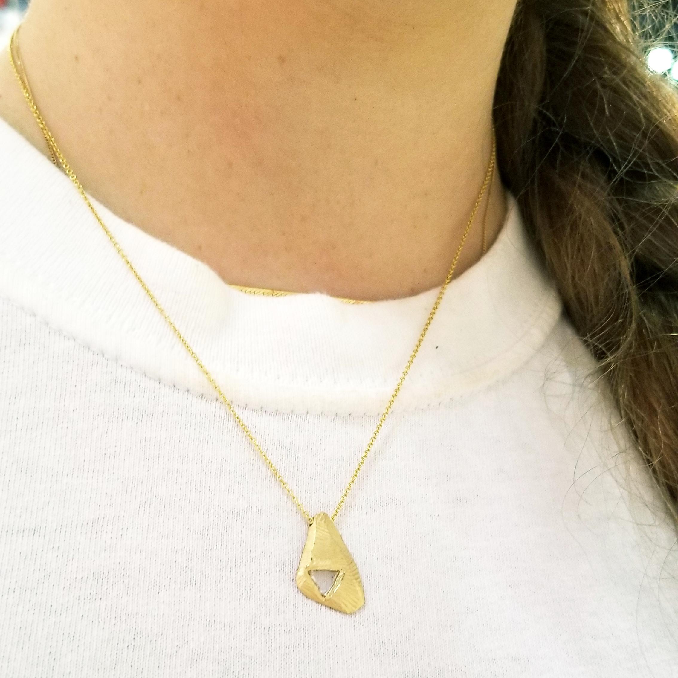 18KT One-of-a-kind diamond tab necklace handcarved necklace with triangle diamond slice tcw .14.  Handcarved by NYC artist Page Sargisson and cast with recycled gold.  Measures 16