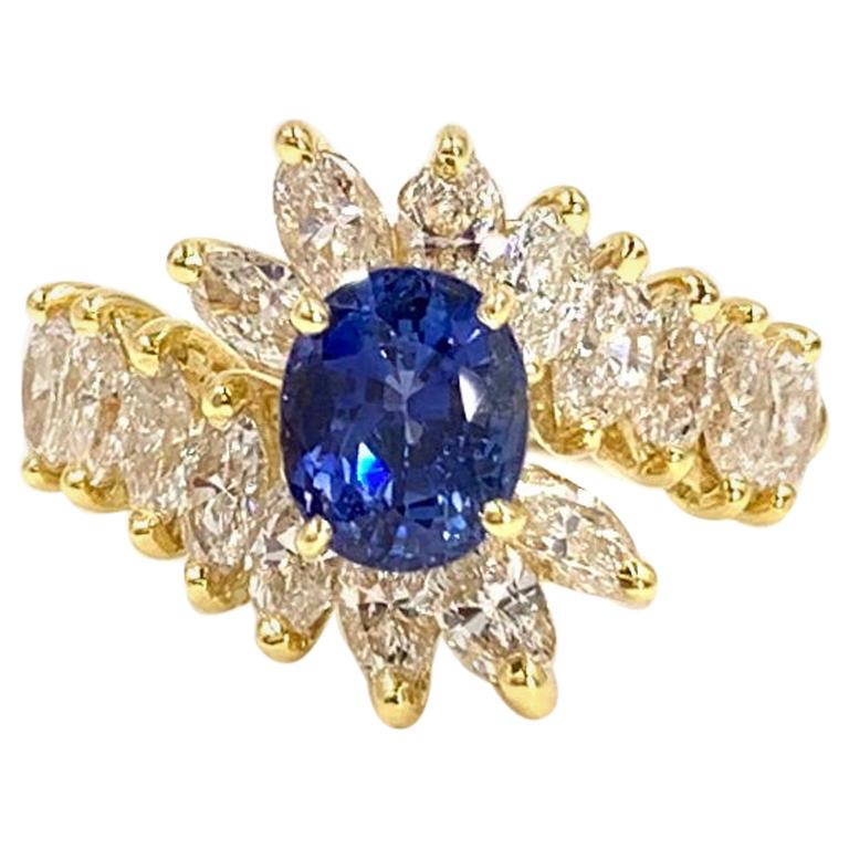 18 Karat Gold Oval Blue Sapphire and Marquise Diamond Cocktail Ring For Sale