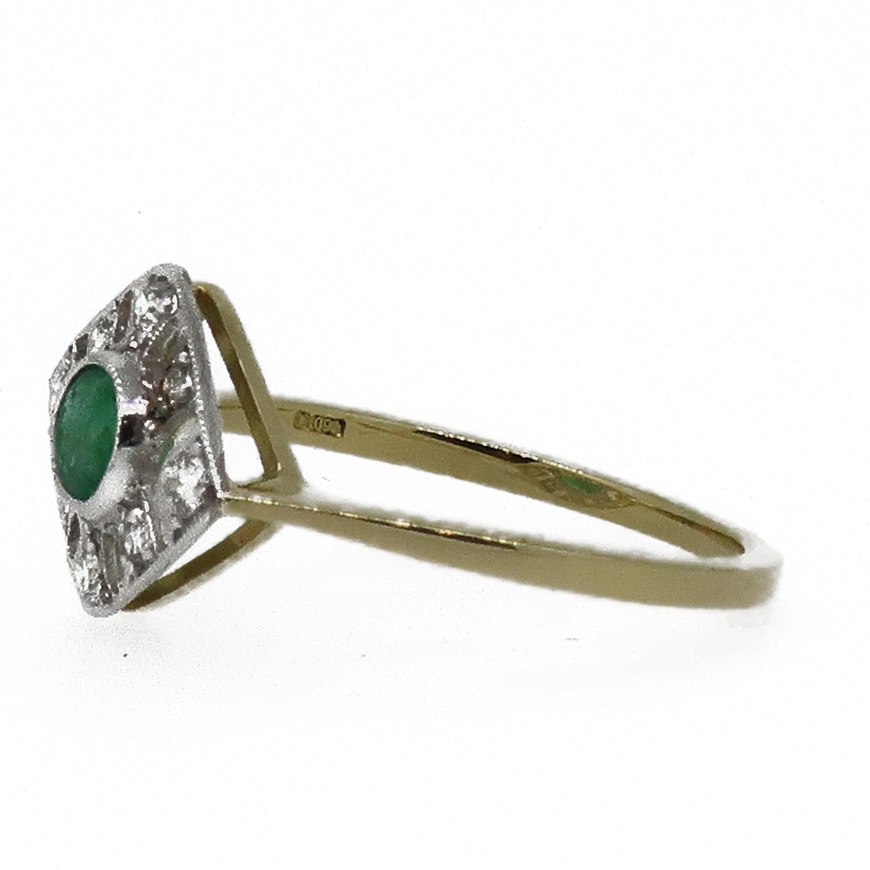 18 Karat Gold Oval Cut Emerald & Diamond Art Deco Style Cluster Ring.

A delicate and dainty oval cut green emerald set in a fine white gold bezel weighing 0.39ct, surrounded by a open frame work of white brilliant cut diamonds all set white gold