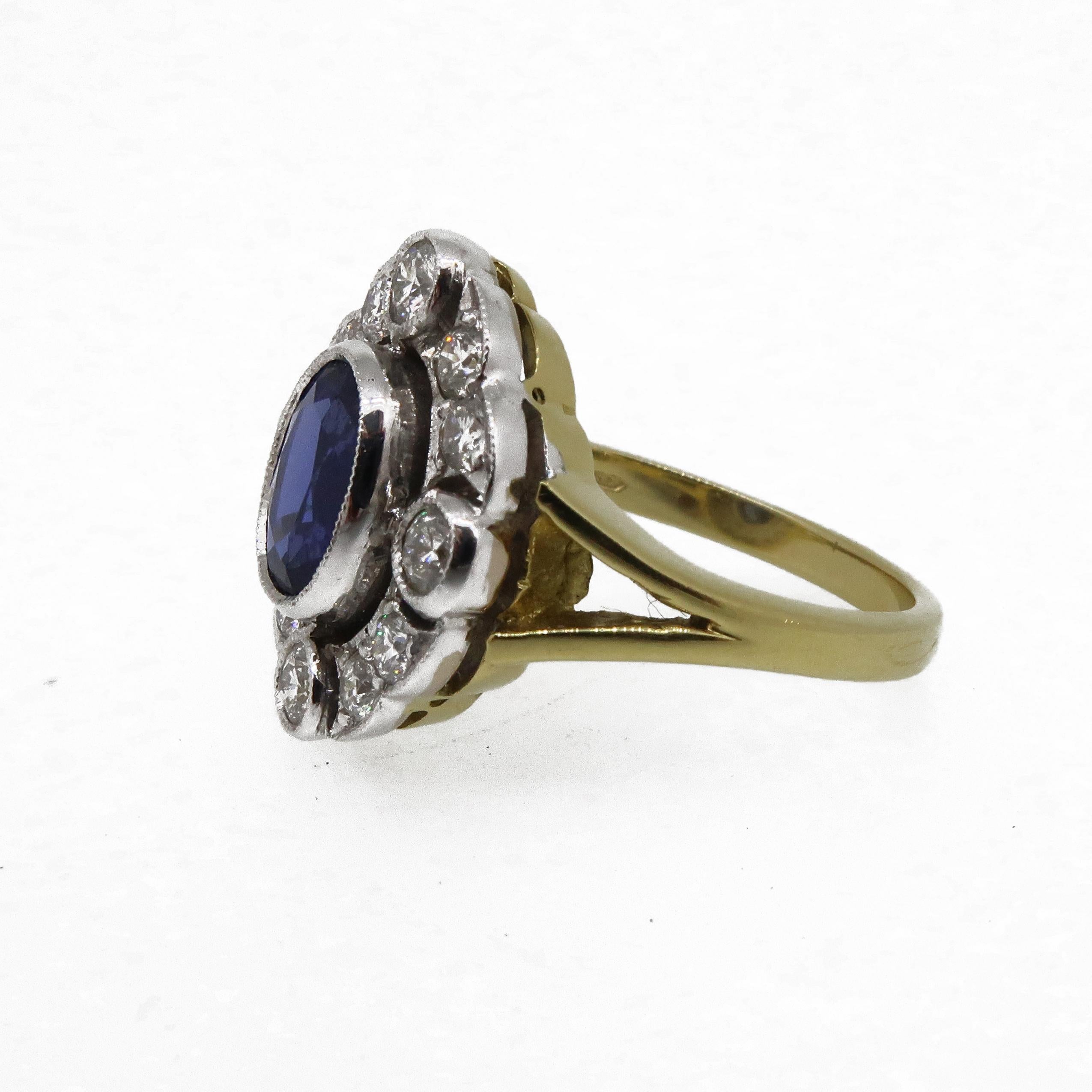 18 Karat Gold Oval Sapphire & Diamond Art Deco Style Cocktail Cluster Ring

A rich royal blue oval sapphire ring. The central sapphire is encased in a delicate white gold millgrain bezel, surrounded by an open framework of brilliant cut diamonds