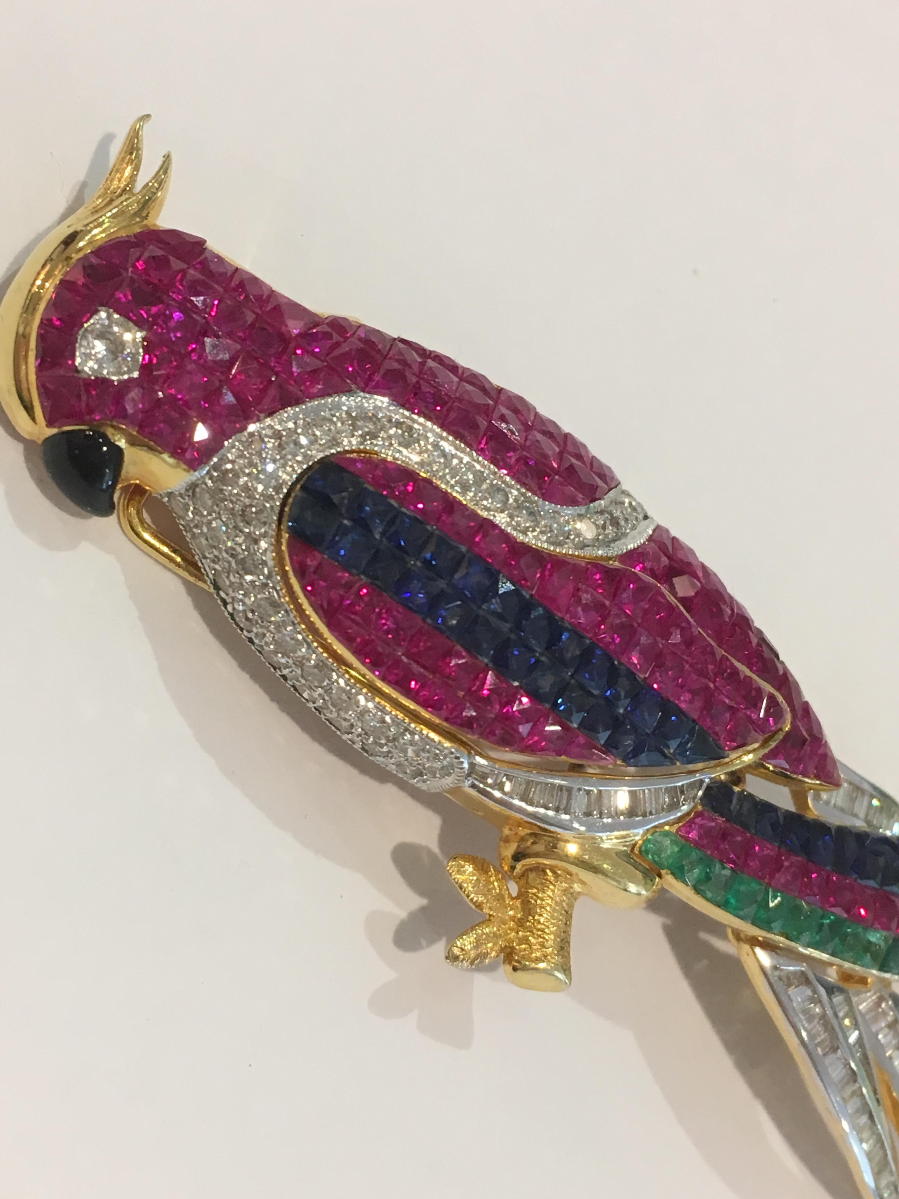 Ladies 18k yellow gold parrot brooch, with rubies, saphires, emeralds and diamonds!

Not stamped 18k but does test 18k

Weighs 20 grams.

There are square invisible set rubies, 3.00 total carats,

1.00 carats blue sapphire,

.50 carats