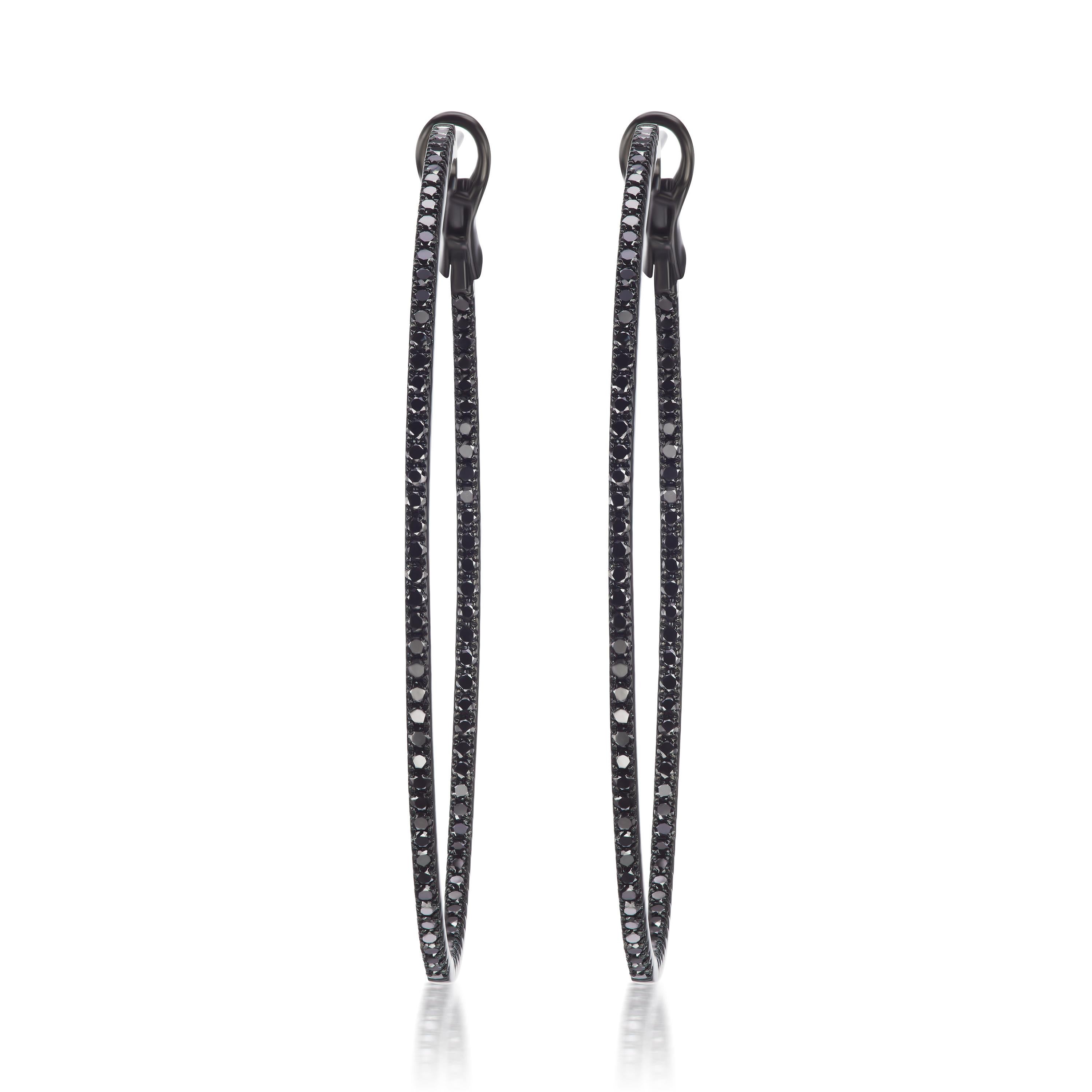 Bold meets sparkle. These hoops are featured with sparkling 172 pave black diamonds set in 18 Karat gold. These hoops come with omega backs.

JEWELRY SPECIFICATION :
Approx. Gold Weight : 8.24 grams
Approx. Diamond Weight : 1.52 carats.
Diamond