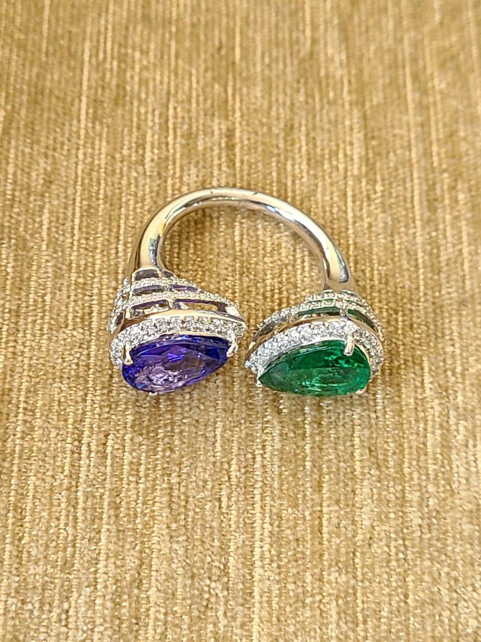 A very beautiful and gorgeous Emerald and Tanzanite Cocktail Ring set in 18K Gold & Diamonds. The Emerald is pear shaped and weighs 2.44 carats. The Emerald is completely natural, without any treatment and is of Zambian origin. The Tanzanite is also