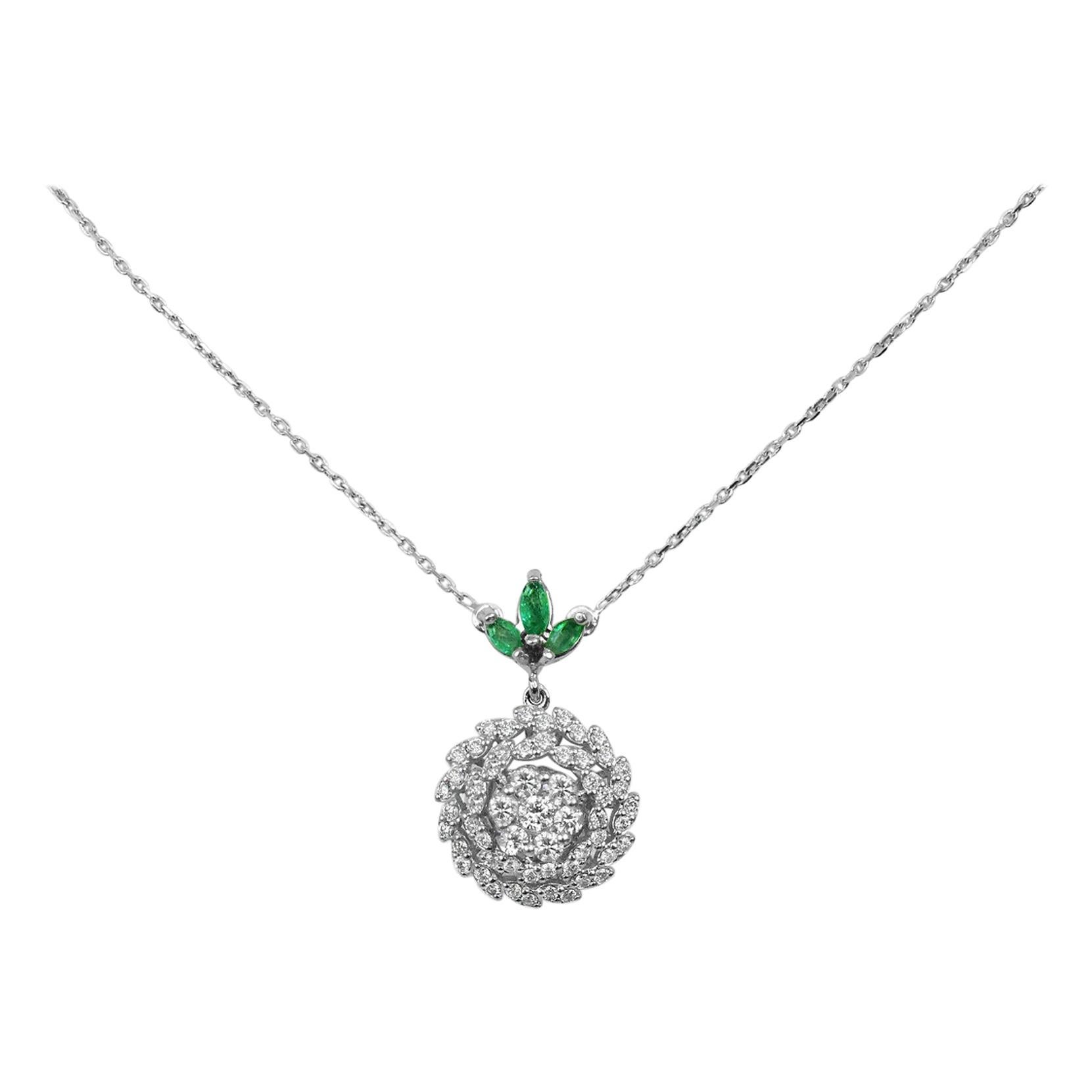 18Karat Gold Pendant Necklace White Gold Diamond Pave Emerald Marquise
        This 18K solid white Gold Emerald / Diamond pendant necklace. The fine Quality gold finishing with marquise shape Zambian emeralds & scintillating cluster pave set