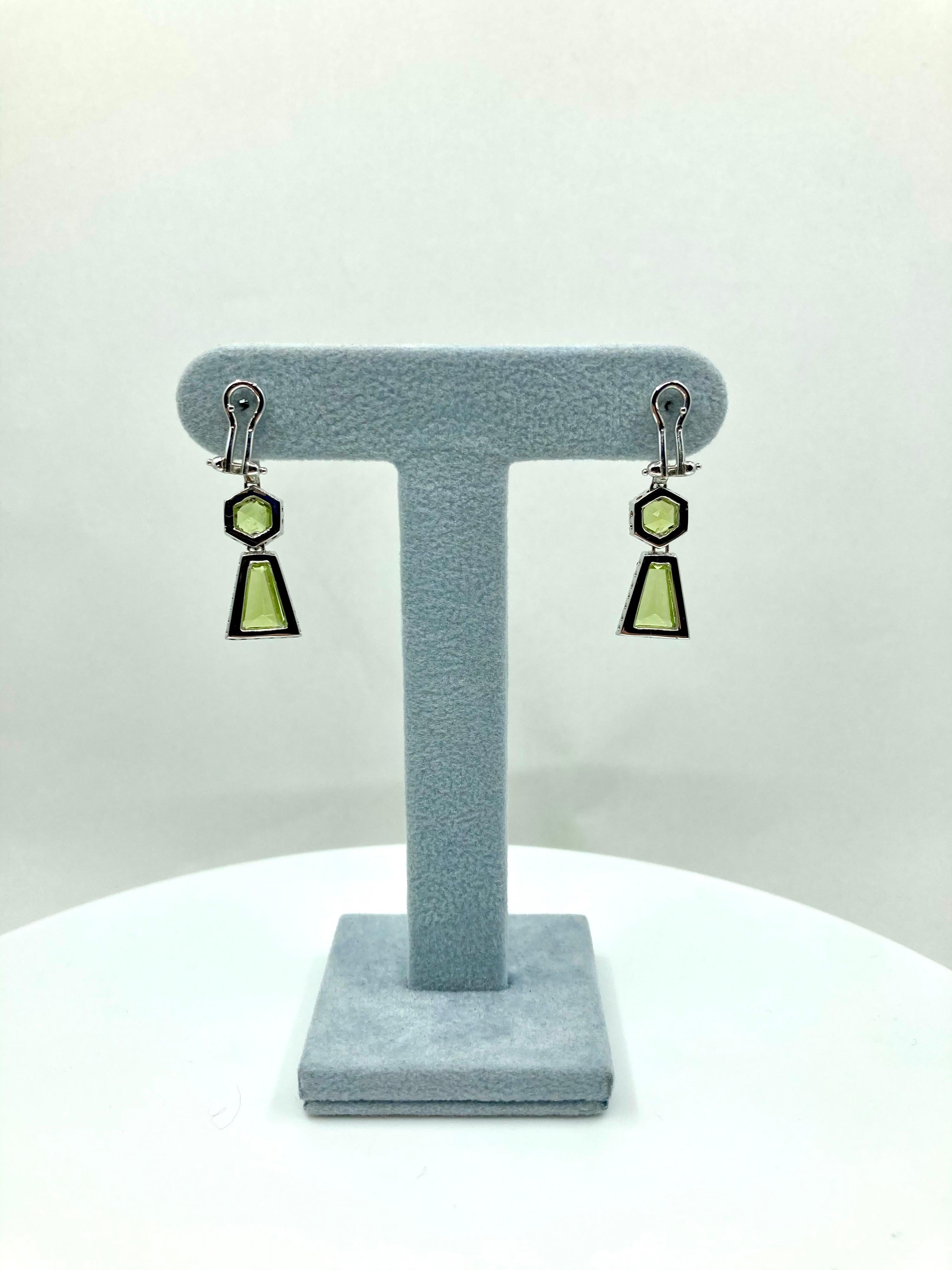 Timeless fine White Gold earrings, with Peridot ct. 3,50 and Diamonds ct. 0,92, Made in Italy by Roberto Casarin. 

For those who are fond of Peridot, these earrings will surely catch the attention. A modern yet timeless design, the two trapezoid