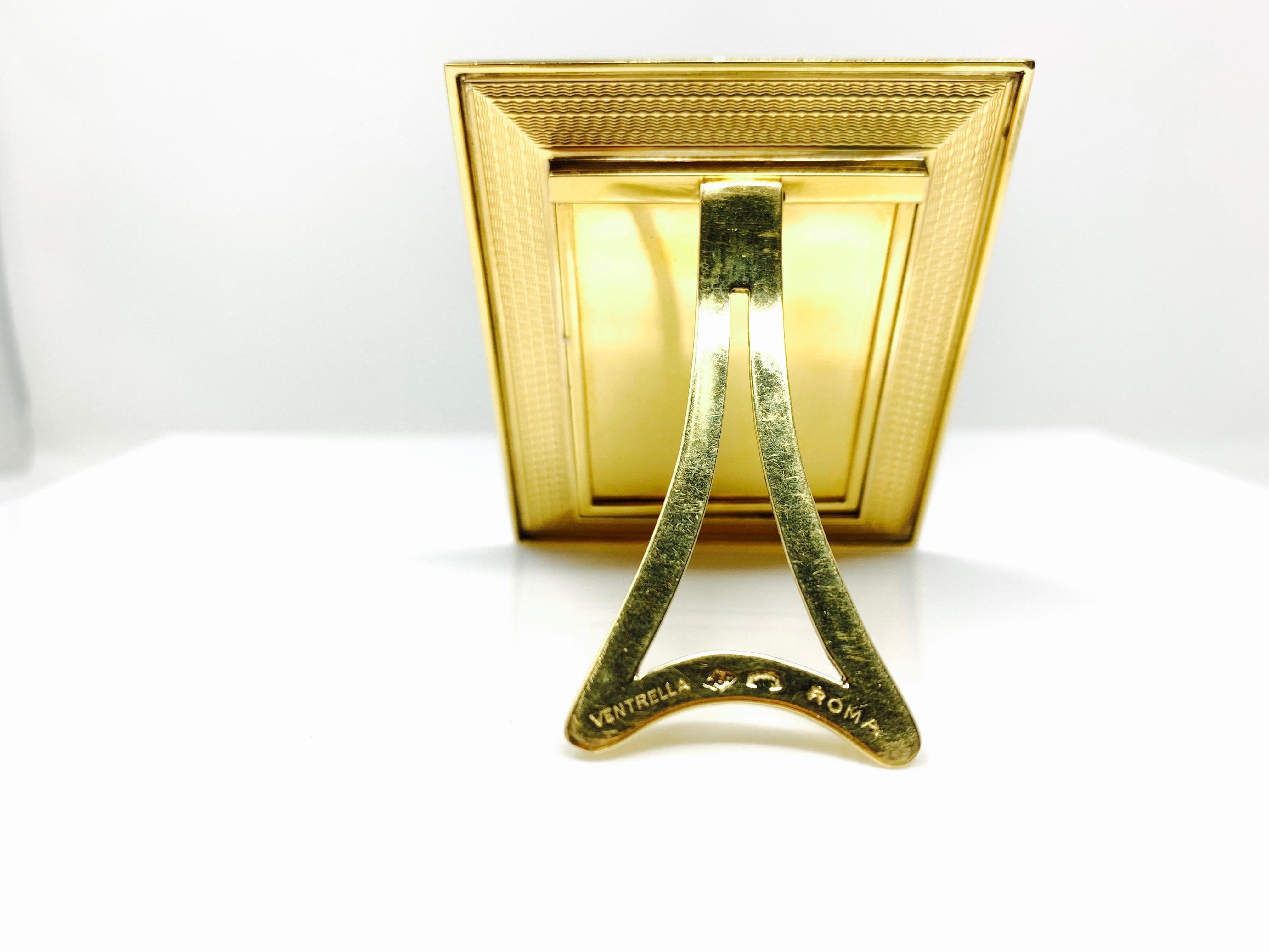 This is a gorgeous 18k yellow gold photo frame. 
Measurements : length : 2 1/2 inch
                           width:   2 1/4  inch