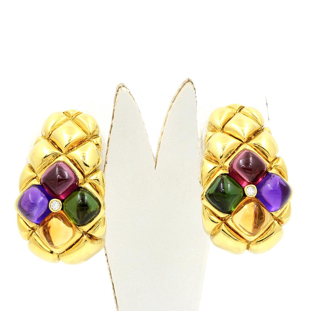 Circa 1980's 18 karat yellow gold half hoop clip-on earrings with a high polish quilted design. These interesting earrings are set with 2 cabochon pink Tourmalines (approximate 3.00 carat total weight), 2 Amethyst cabochons (approximate 2.70 carat