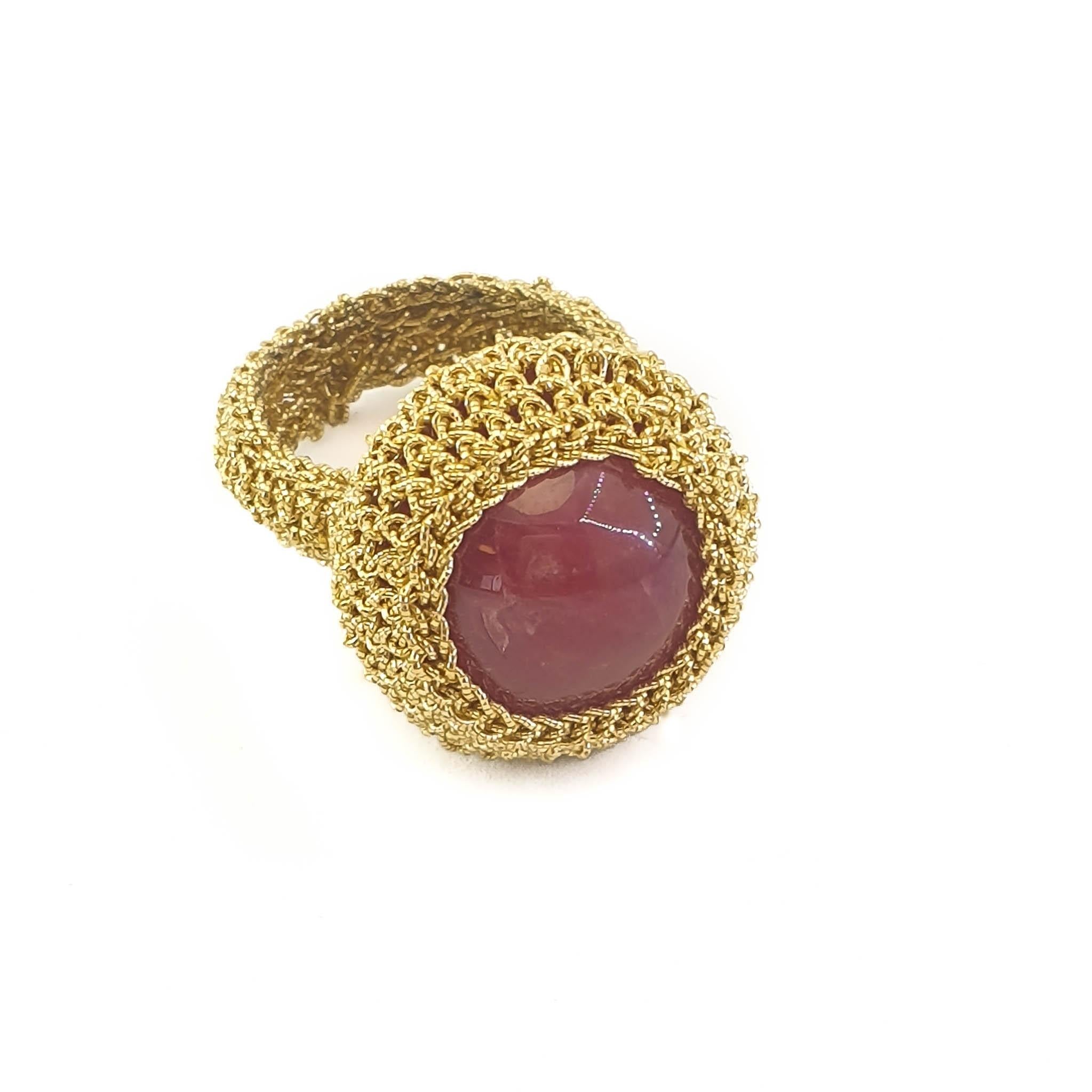 Beautifully crafted hand crochet gold thread (4.1 grams) ring ( with a natural Rhodonite (weighing 7.53 grams/37.65 carats). It is an eye catching ring with a lot of presence. This ring is a 7.75 US size. It can be stretched a little to fit a larger