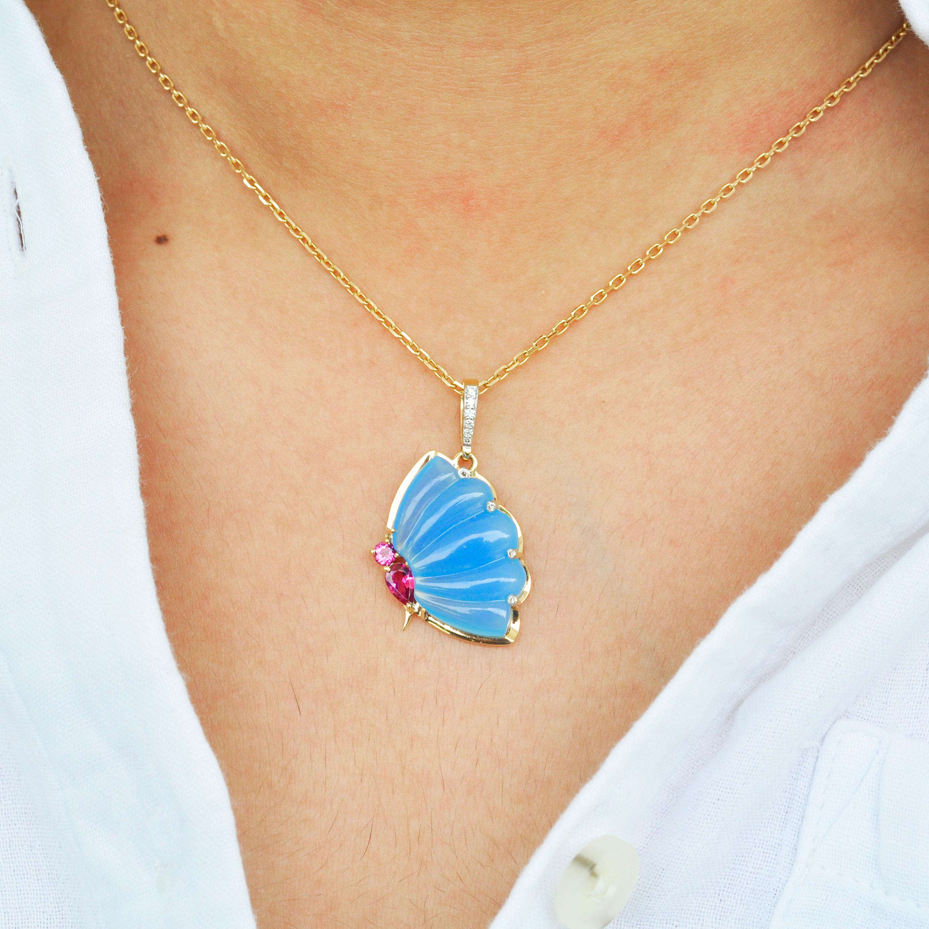18 karat gold pink tourmaline blue chalcedony butterfly carving diamond pendant necklace

This elegant and chic butterfly pendant is so beautiful and contemporary. The blue chalcedony is carved with subtle curves and lines to form a wing of a