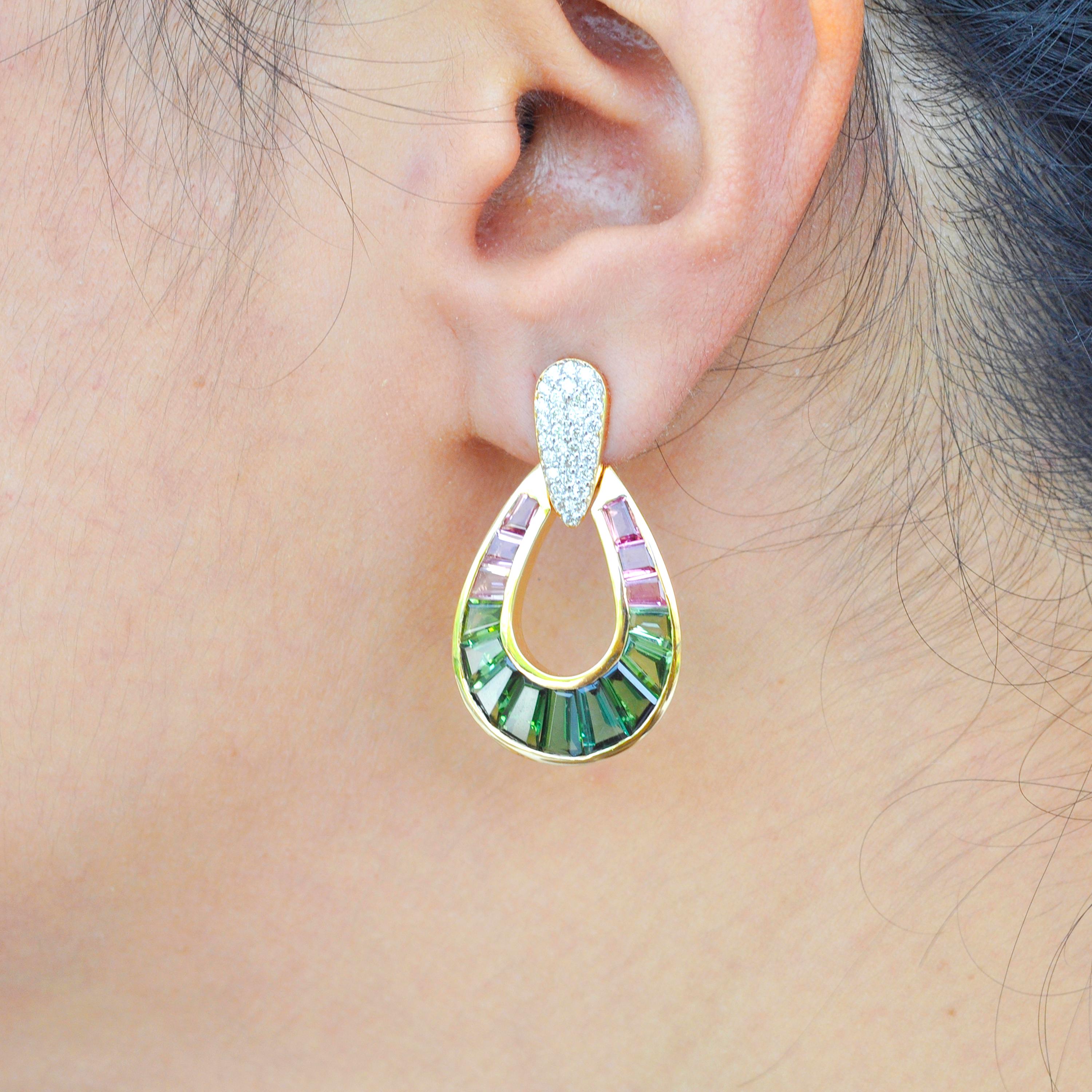 18 karat gold taper baguette green tourmaline and pink tourmaline diamond dangle drop earrings

Watermelon tourmalines are exotic, always. Inspired by it's colours, these earrings feature lustrous caliber cut green and pink tourmalines, meticulously