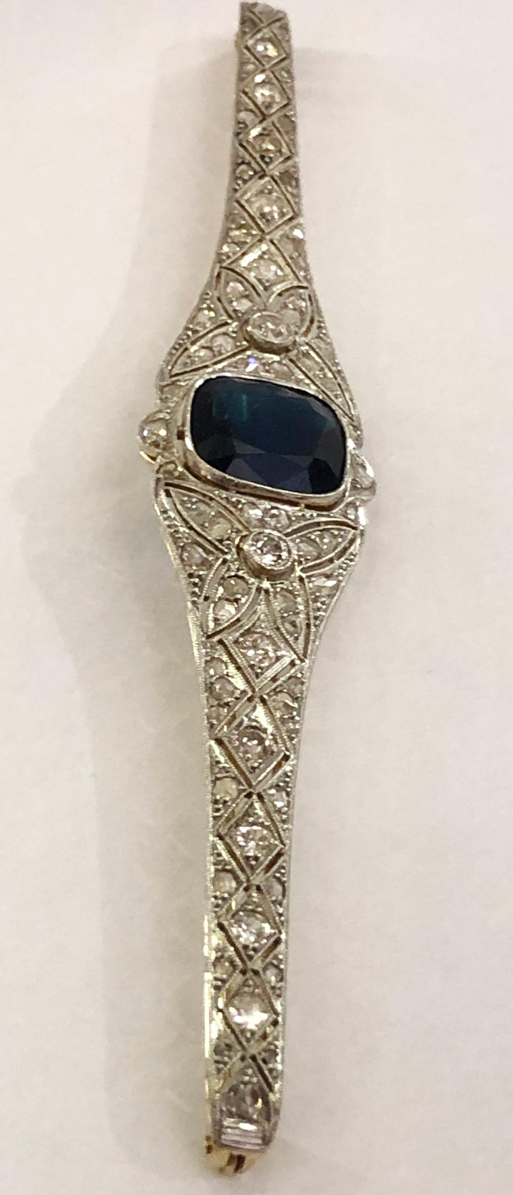 Vintage platinum and 18 karat yellow gold bar brooch, with brilliant diamonds and glass paste, Italy 1900s-1920s 
Length 12.5cm