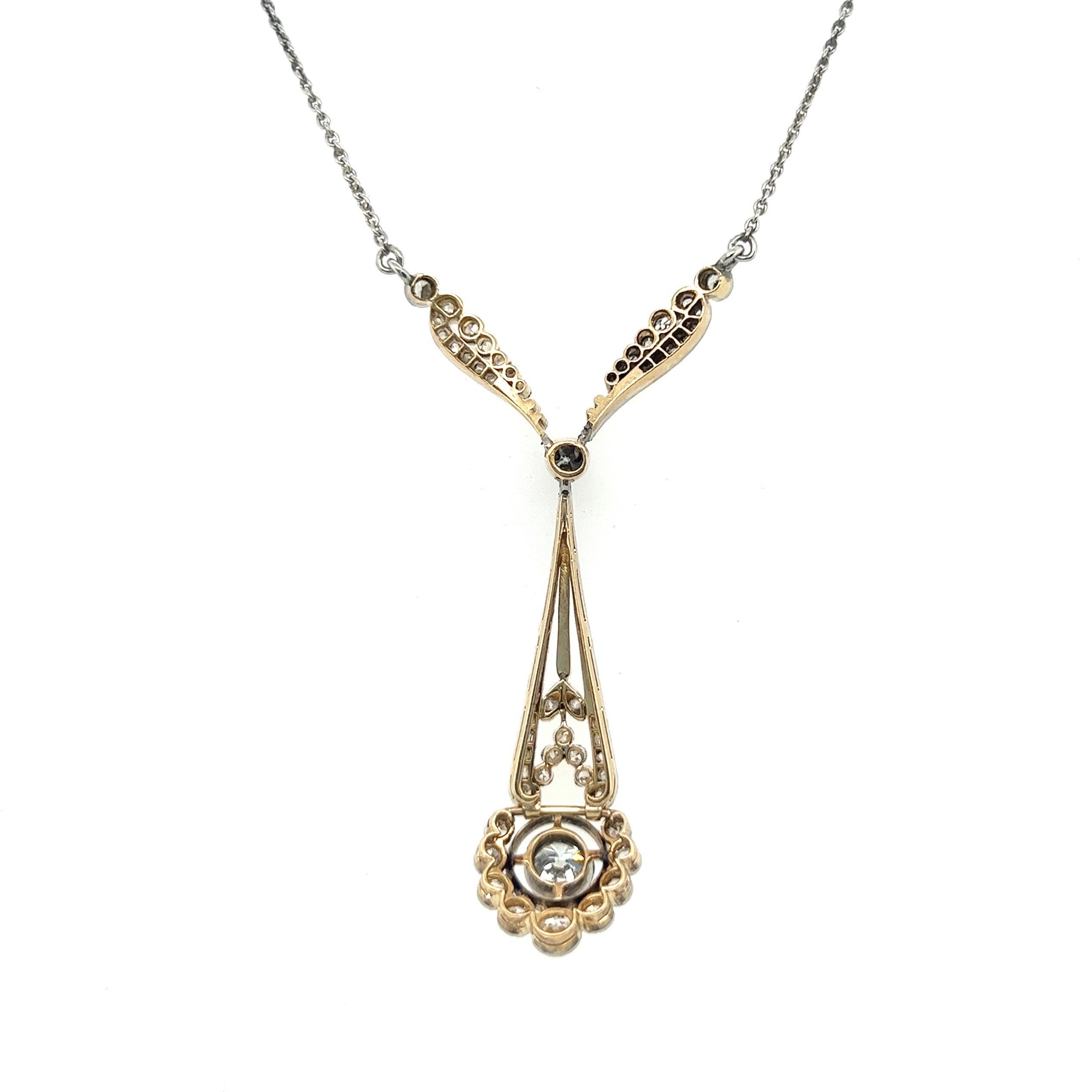 Elegant and feminine 18 karat yellow gold, platinum and diamond Belle Epoque/Edwardian necklace, circa 1900.

Consisting in a finely handcrafted Y-shaped pendant in platinum over 18 karat yellow gold and a fine anchor chain in platinum. The pendant