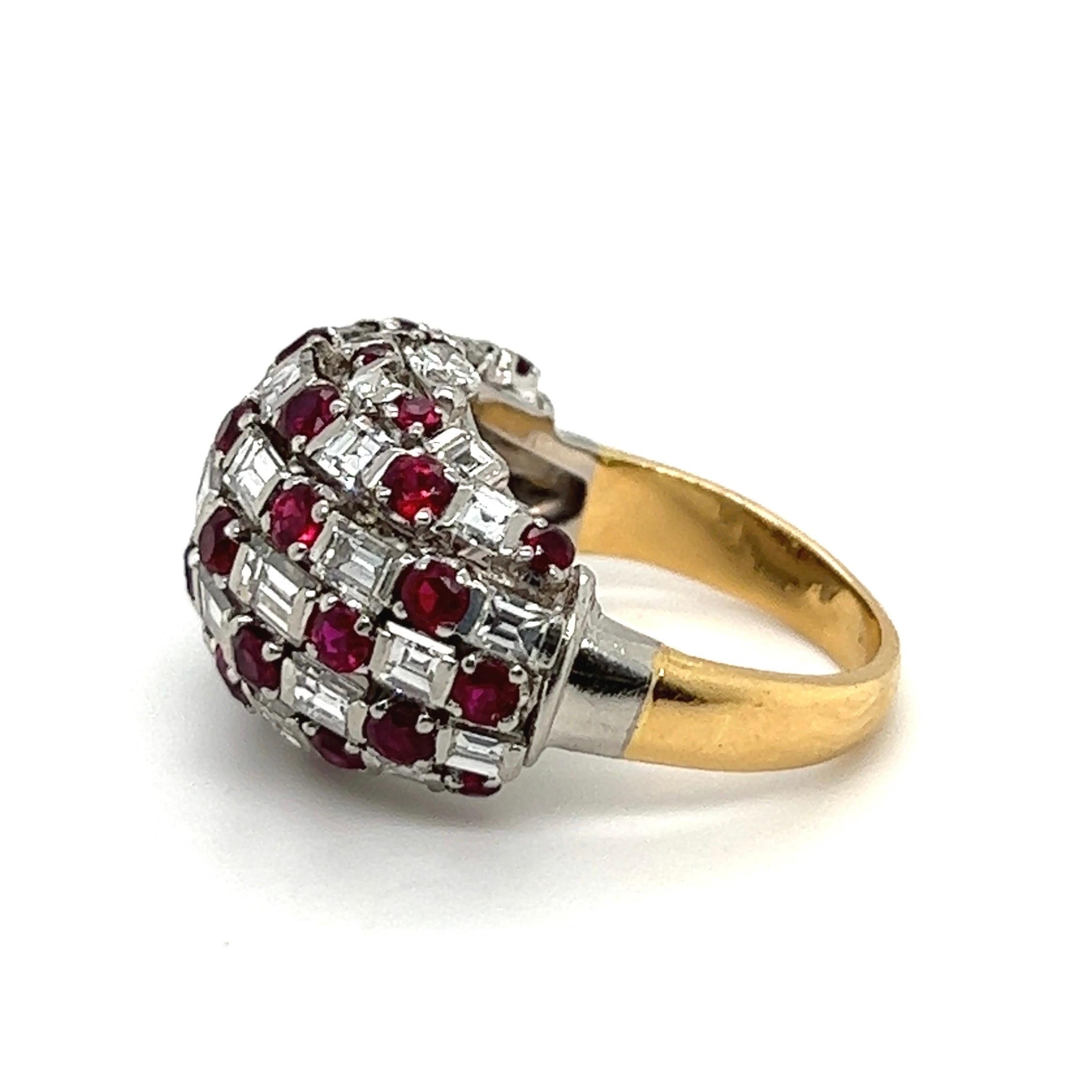 Ravishing 18 karat yellow gold, platinum, diamond and ruby cocktail ring from the 1950s.
Of bombé design, crafted in 18 karat yellow gold and platinum, the dome featuring a checkerboard pattern consisting of round faceted rubies totalling circa 1.6