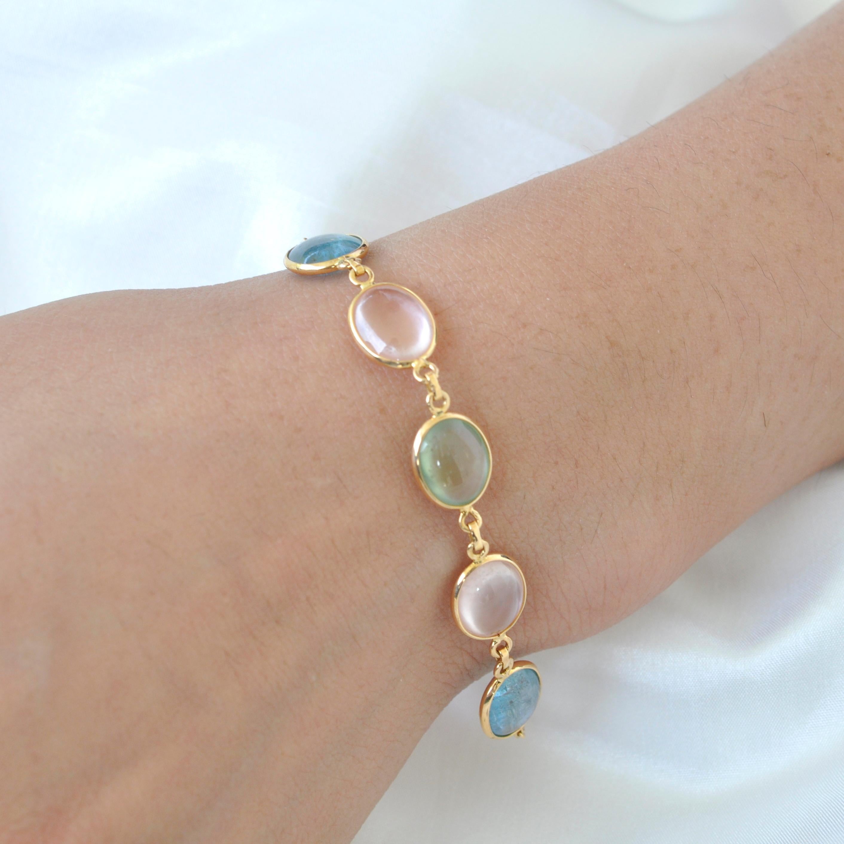 These stunning prehnite, rose quartz, aquamarine 18k yellow gold bracelet provide a look that is both trendy and classic. This bracelet are a great staple to add to your collection, and can be worn with both casual and formal wear. It would make the