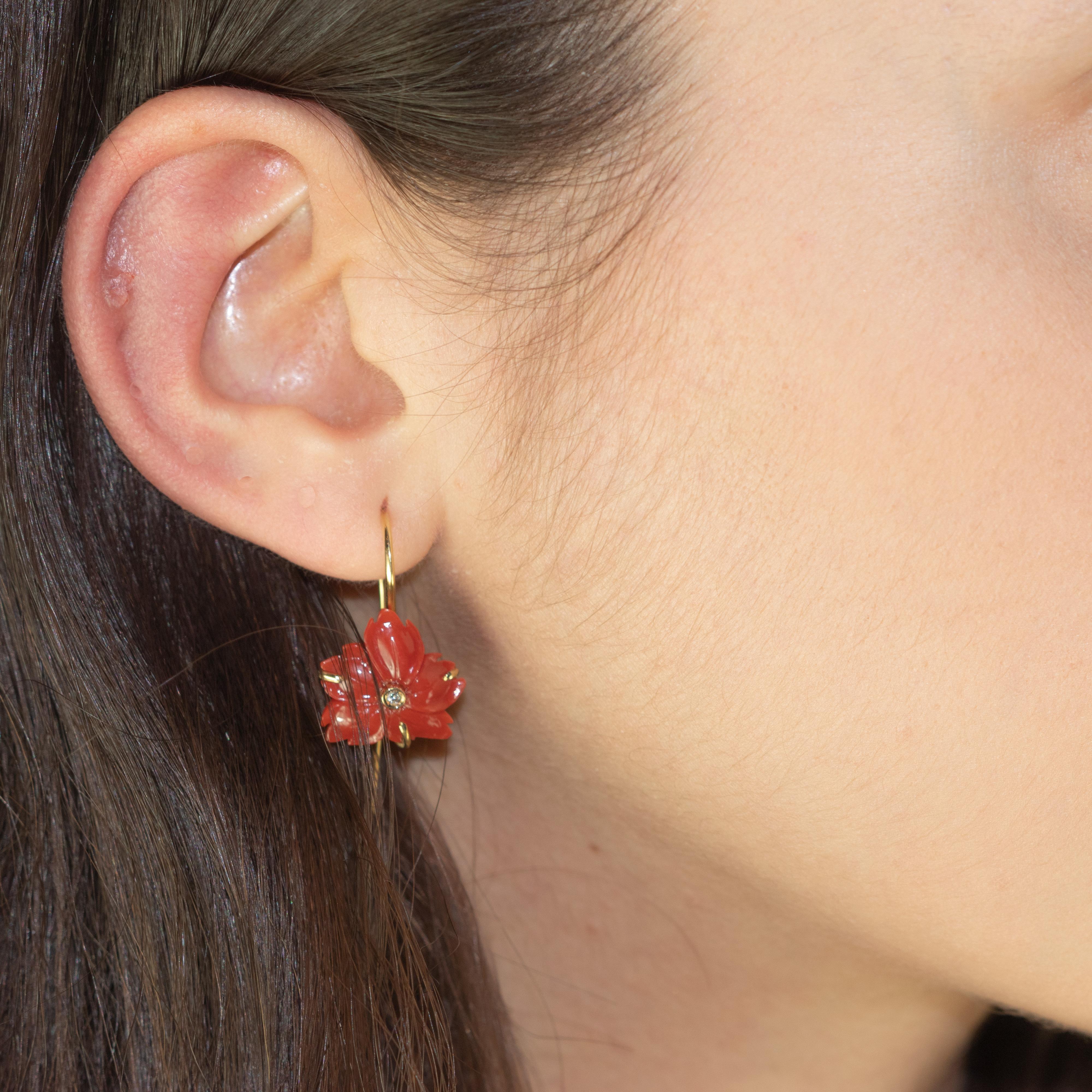 Breathtaking and sweet flower earrings. Red coral carved petals that evoke the italian handmade traditional coral work, a long 18 karat gold stem and round diamond stigmas. 
 
This delicate design shows the sweetness and innocence of the jewelry. It